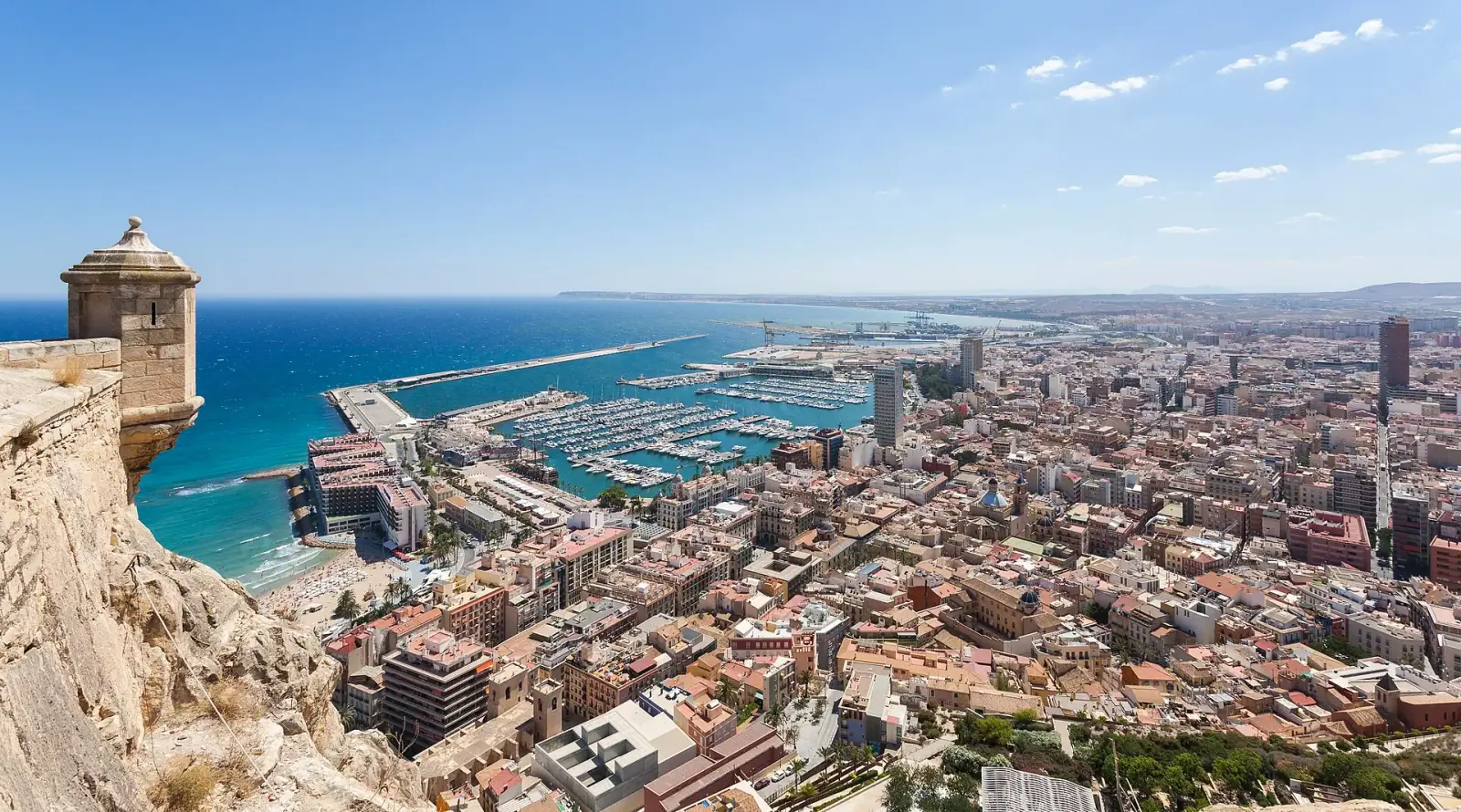 Aerial view of Alicante from Santa Barbara Castle showing the city, marina, and Mediterranean Sea