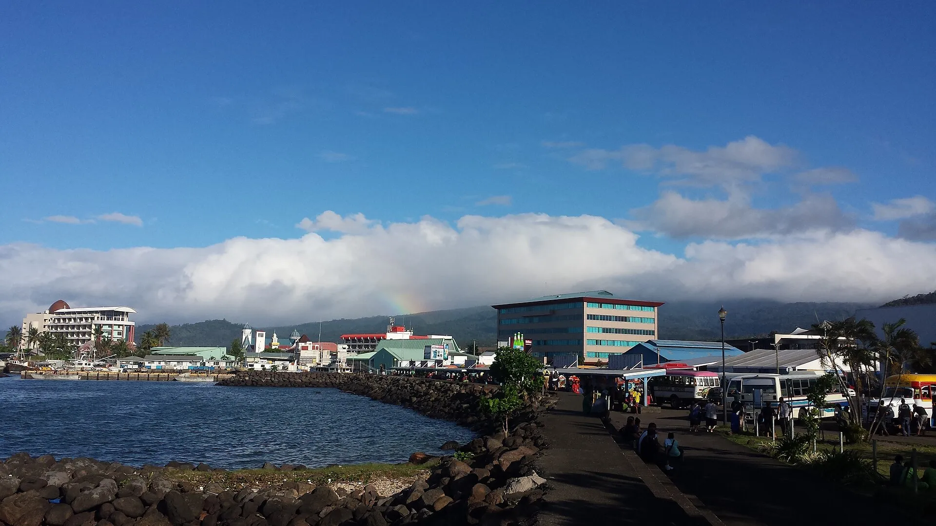 The Apia waterfront under a rainbow