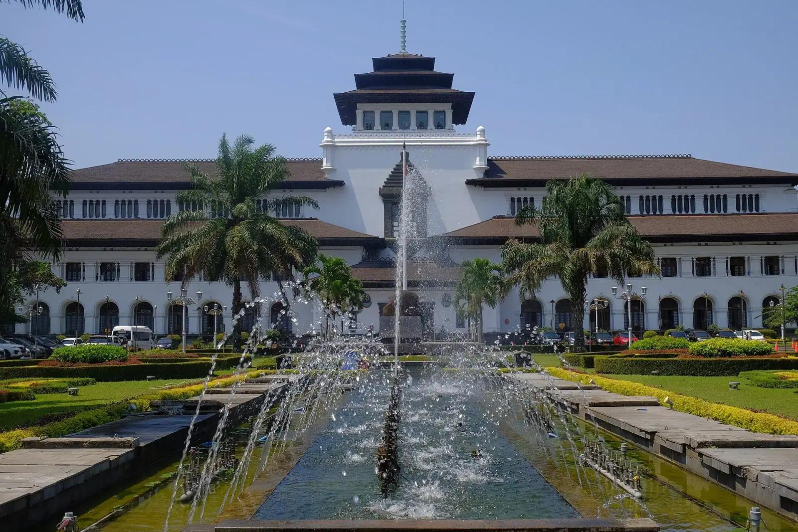 Gedung Sate colonial building with fountain and palm trees, Bandung, Indonesia