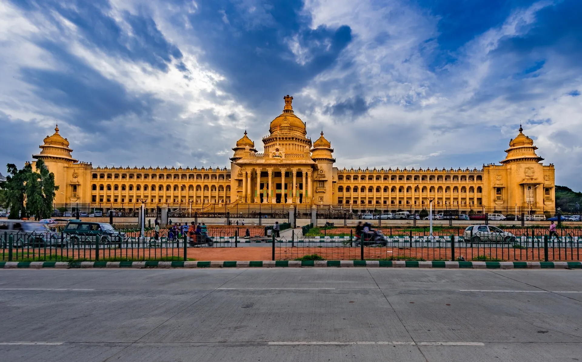 Vidhana Soudha, the Karnataka state legislature building in Bangalore, under a dramatic cloudy sky