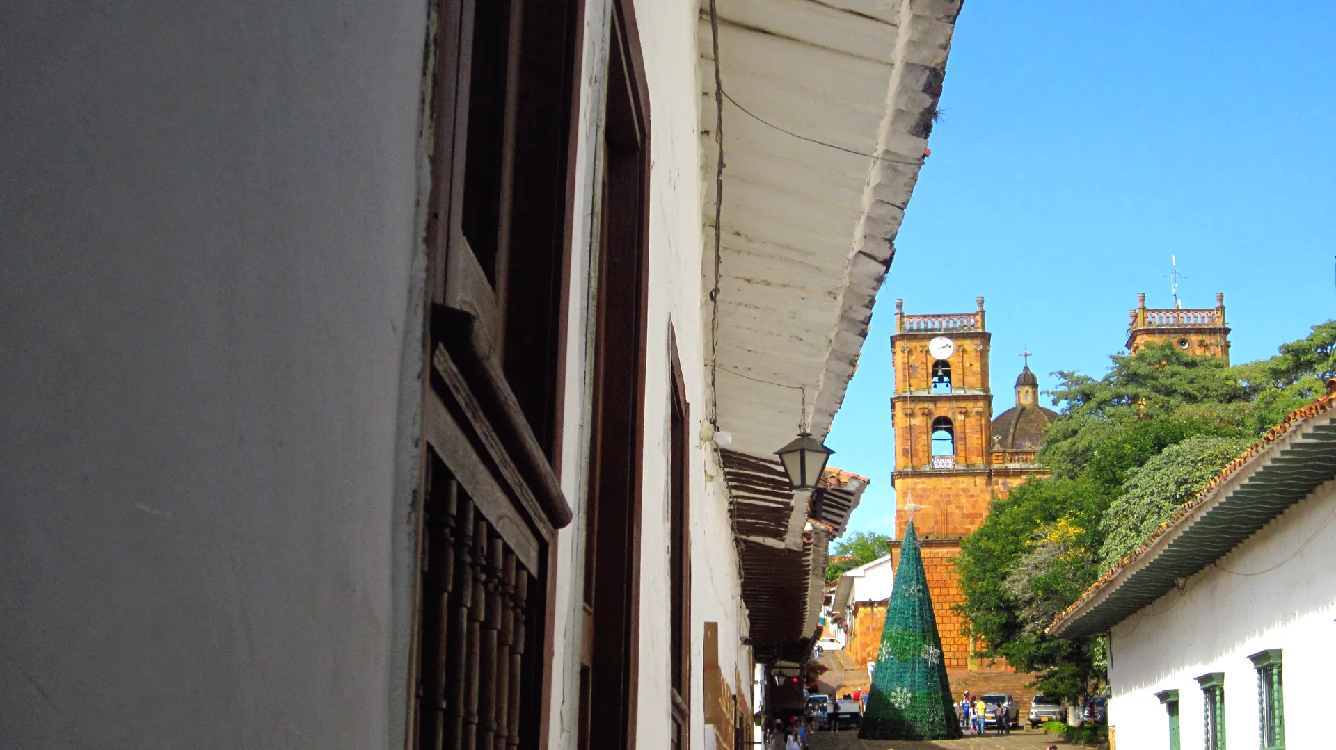 A colonial street and the sandstone church of Barichara, Colombia