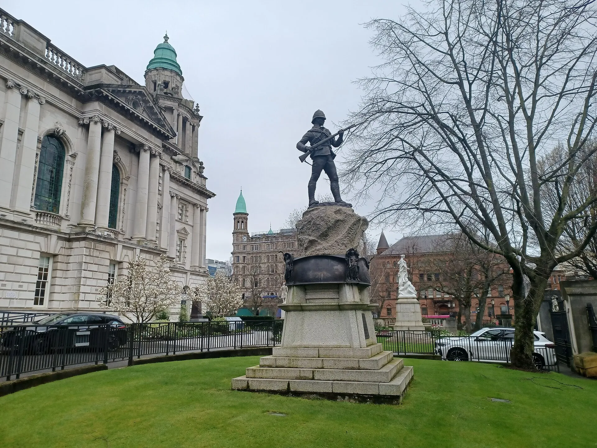 Belfast City Hall with its green copper dome and classical facade, seen from Donegall Square gardens