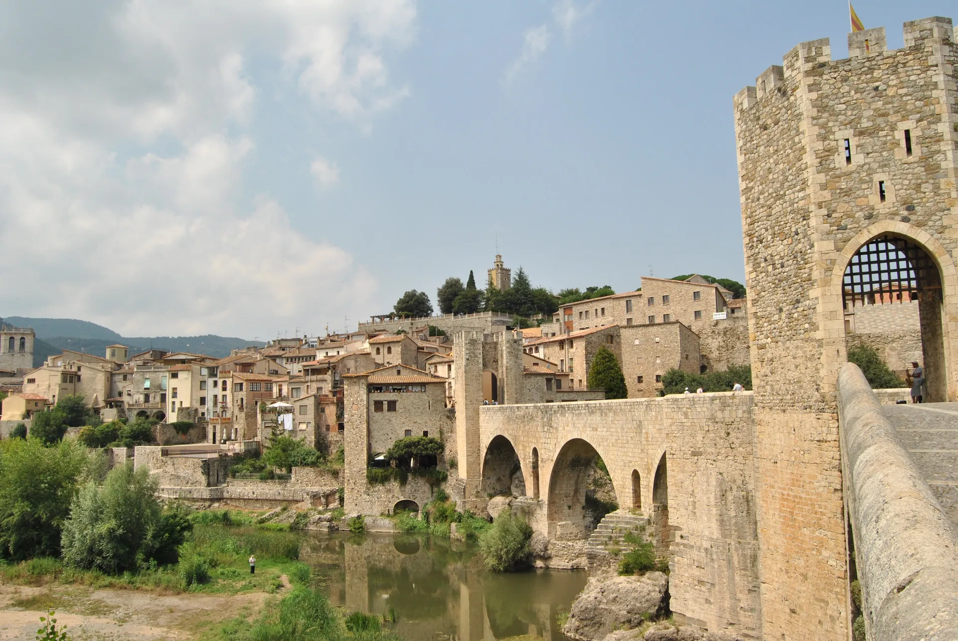 The fortified medieval bridge and golden-stone town of Besalu, Catalonia