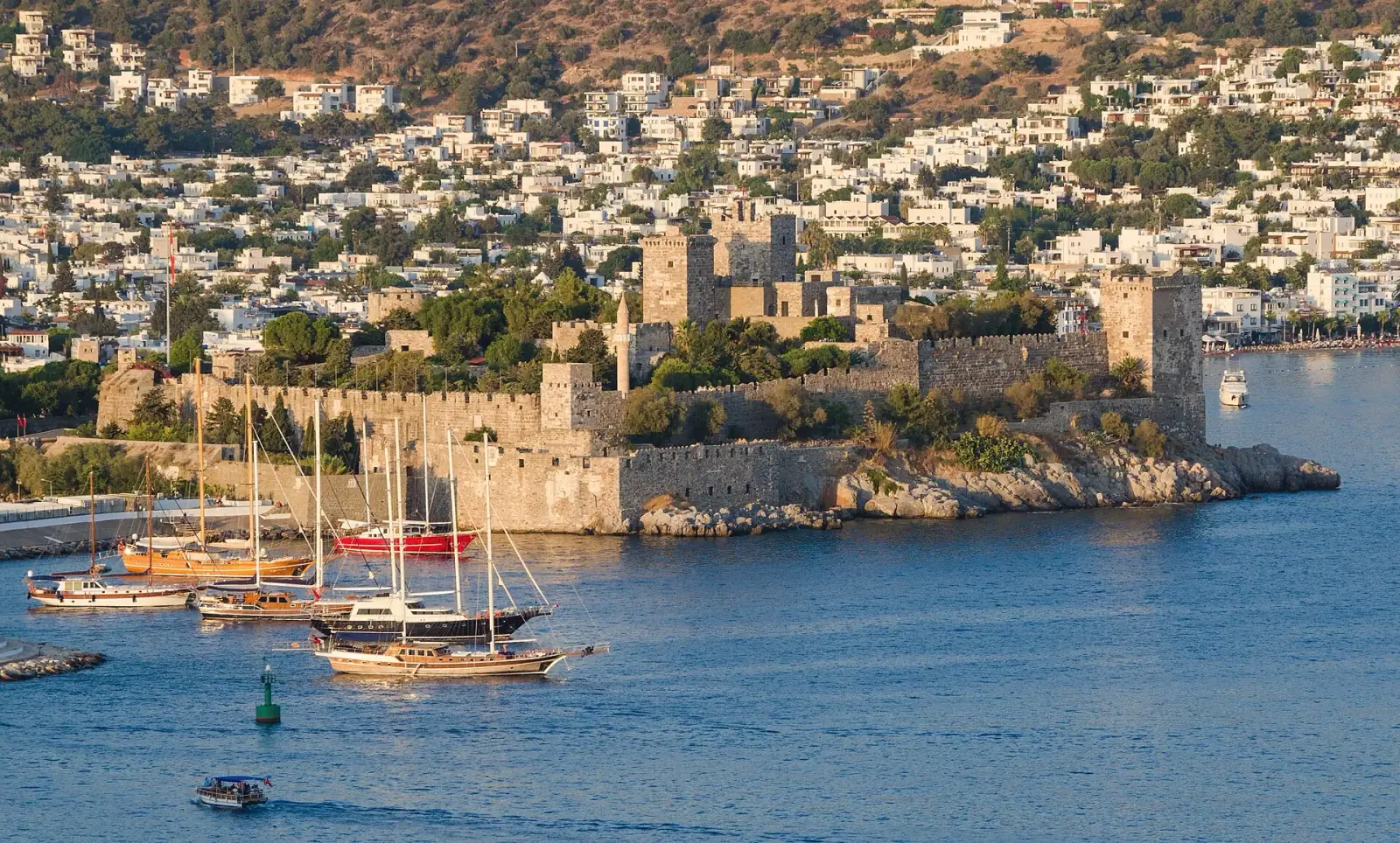 Bodrum Castle and harbor with sailboats and white hillside buildings, Turkey