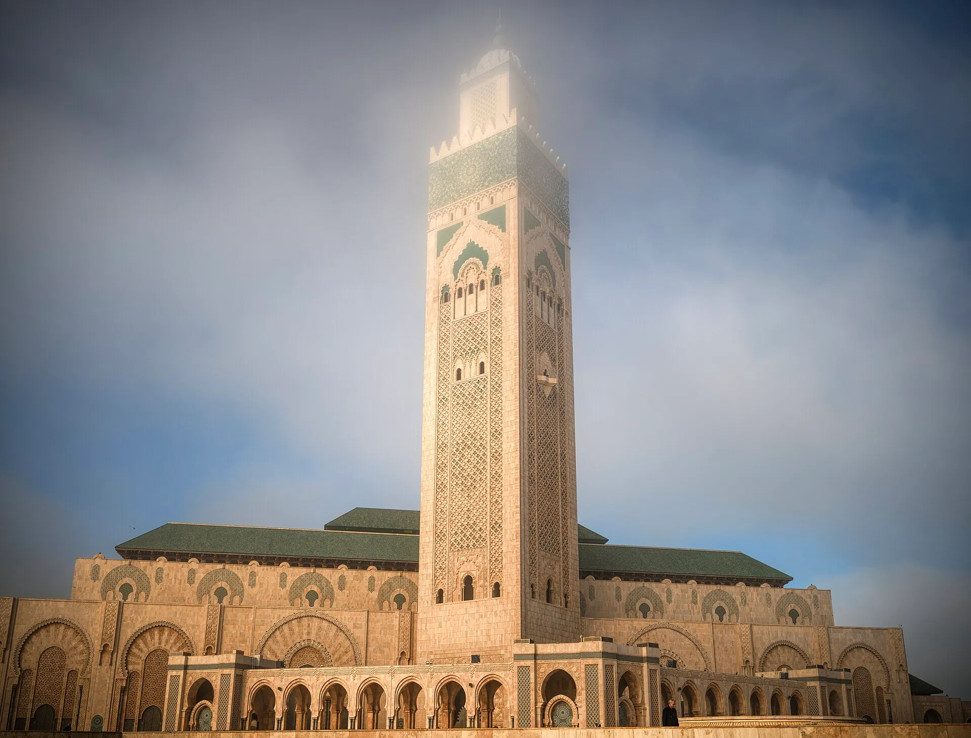 Hassan II Mosque minaret rising through morning mist in Casablanca, Morocco