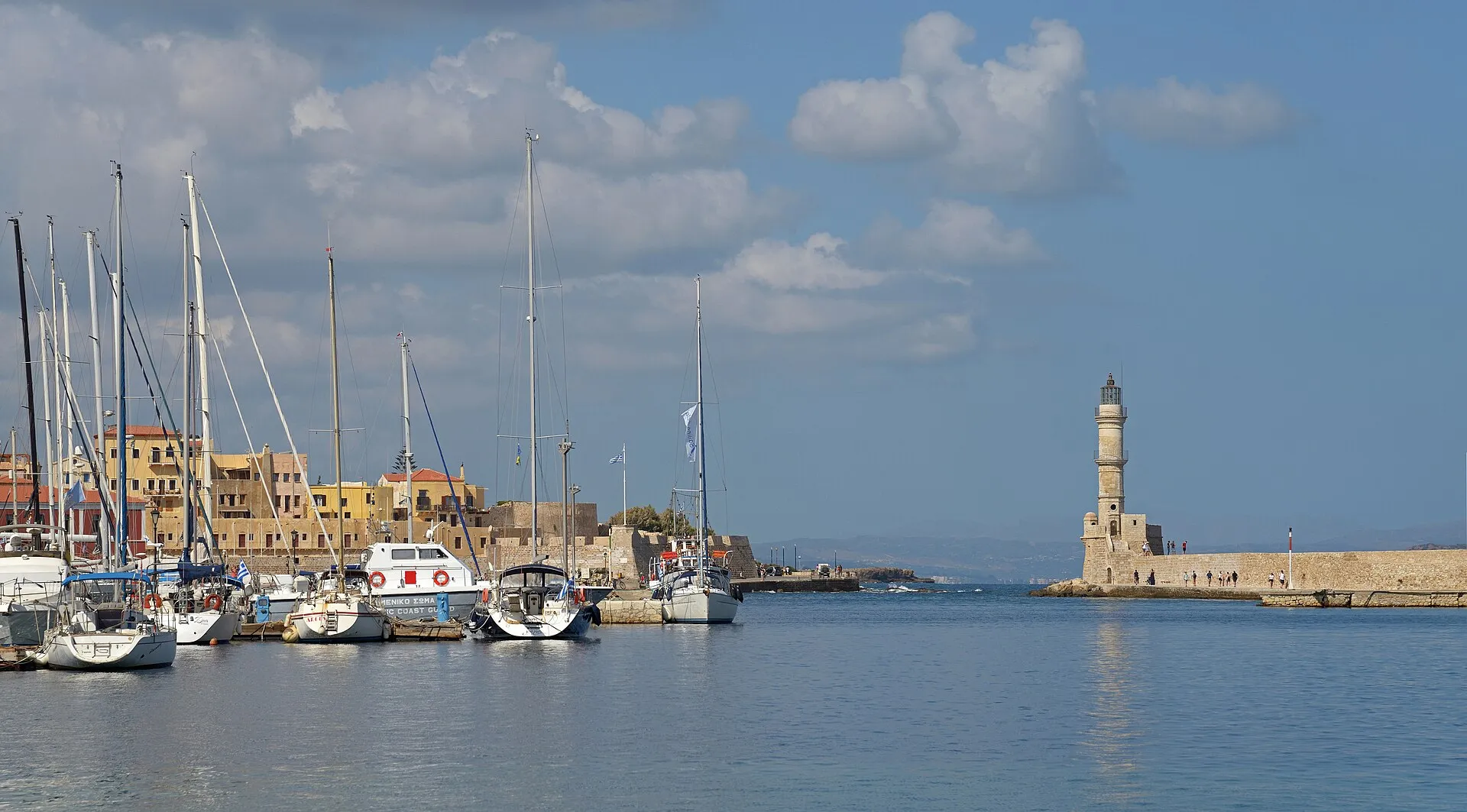 Chania Venetian harbour with lighthouse and sailboats, Crete