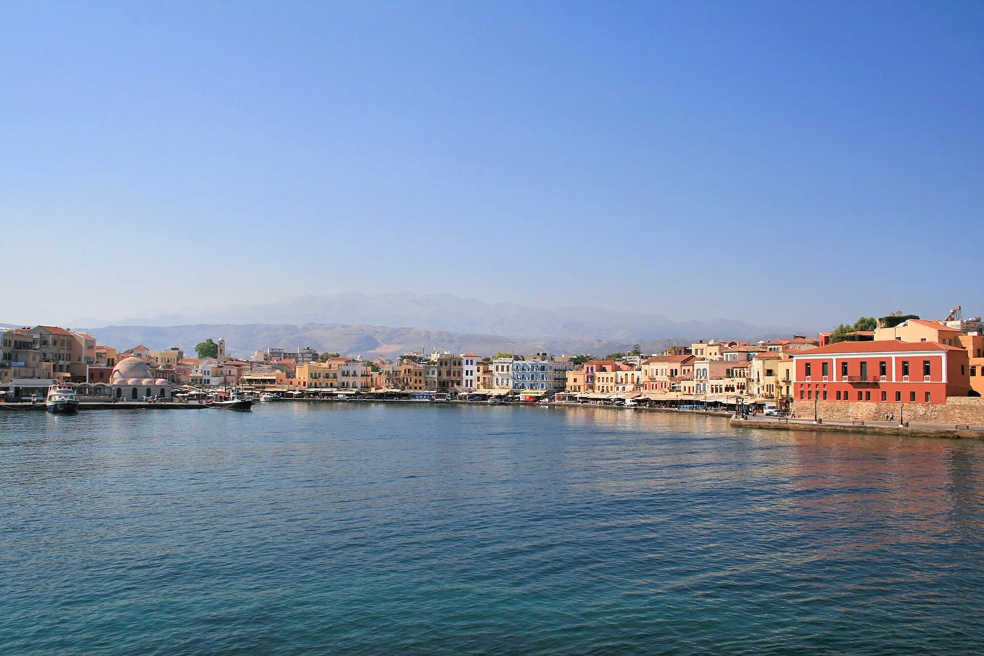 Chania Venetian harbour panorama with mosque dome and White Mountains, Crete