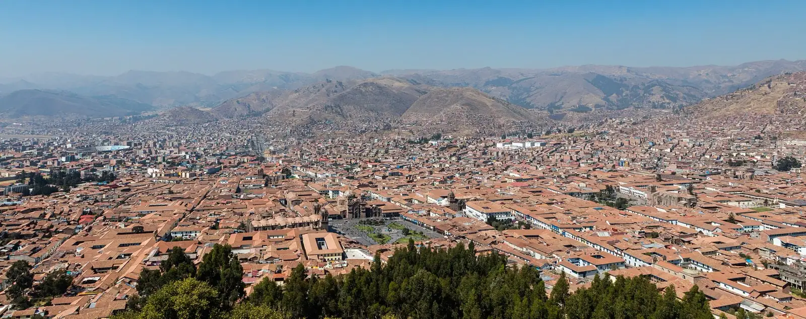 Aerial panorama of Cusco, Peru, with the Plaza de Armas and Andean mountains