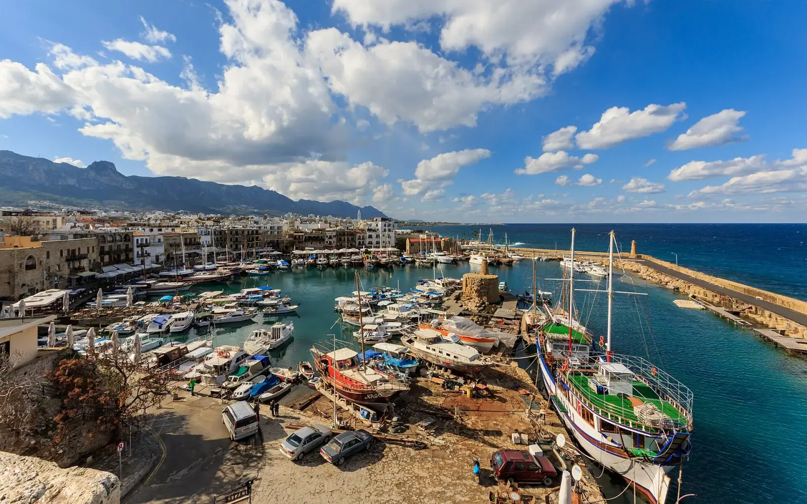 Kyrenia old harbour with boats, mountains and Mediterranean sea, Cyprus
