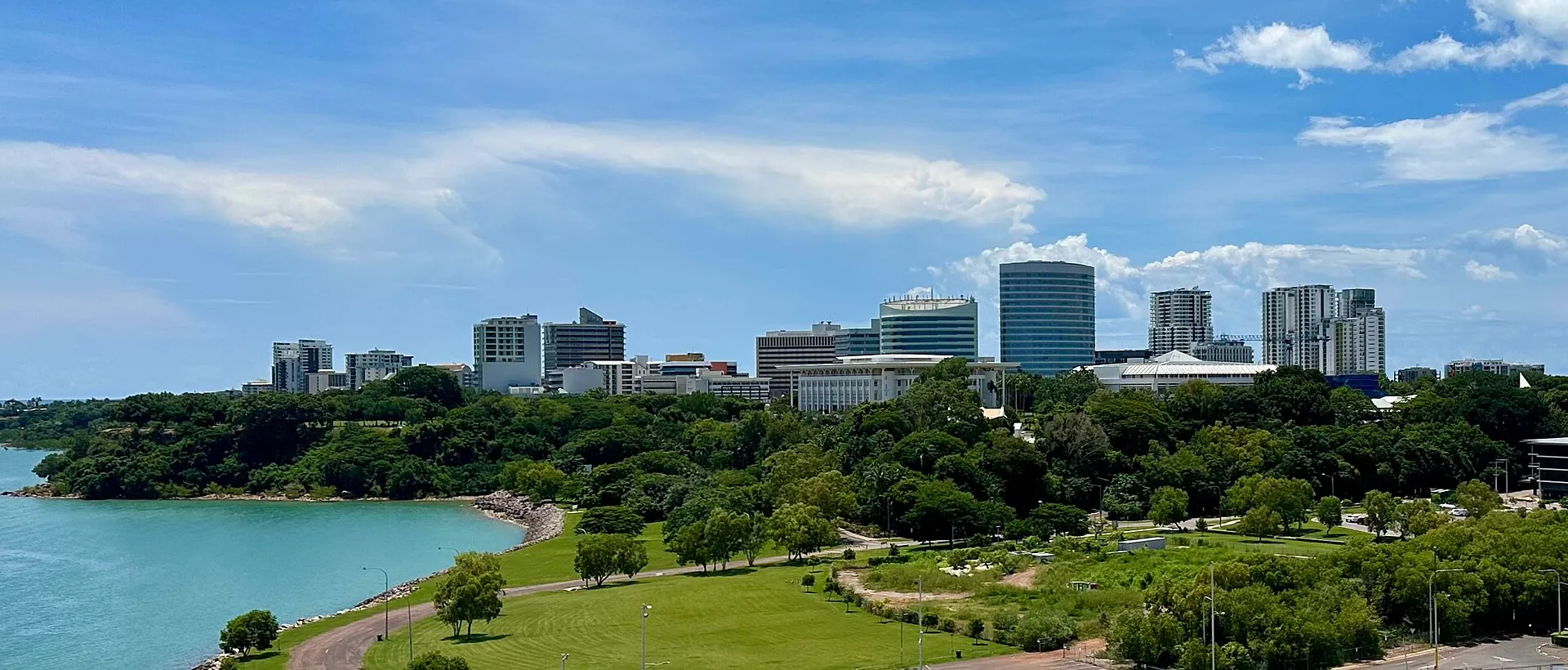 Darwin city skyline with turquoise harbour and tropical parkland