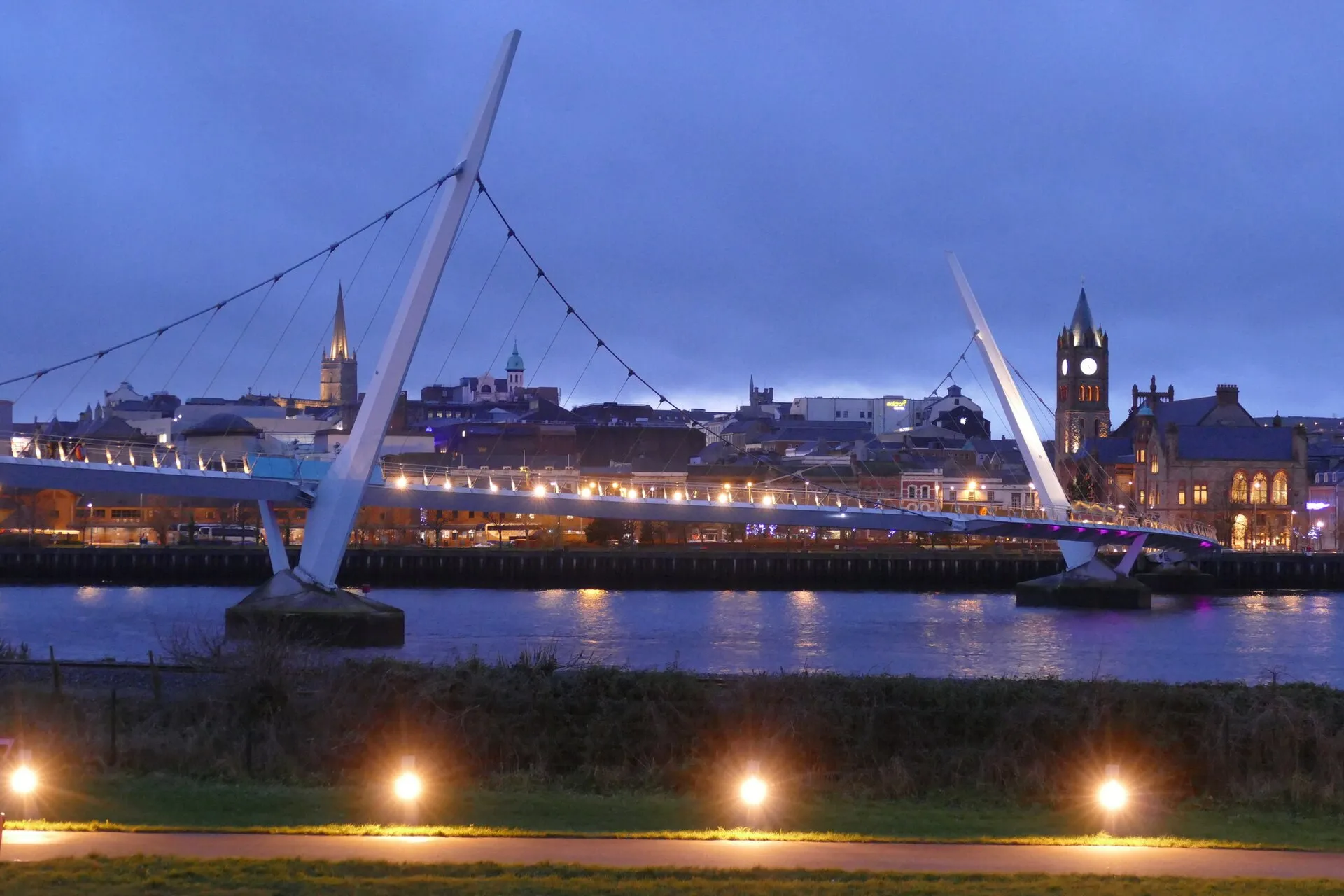 The Peace Bridge at dusk over the Foyle at Derry