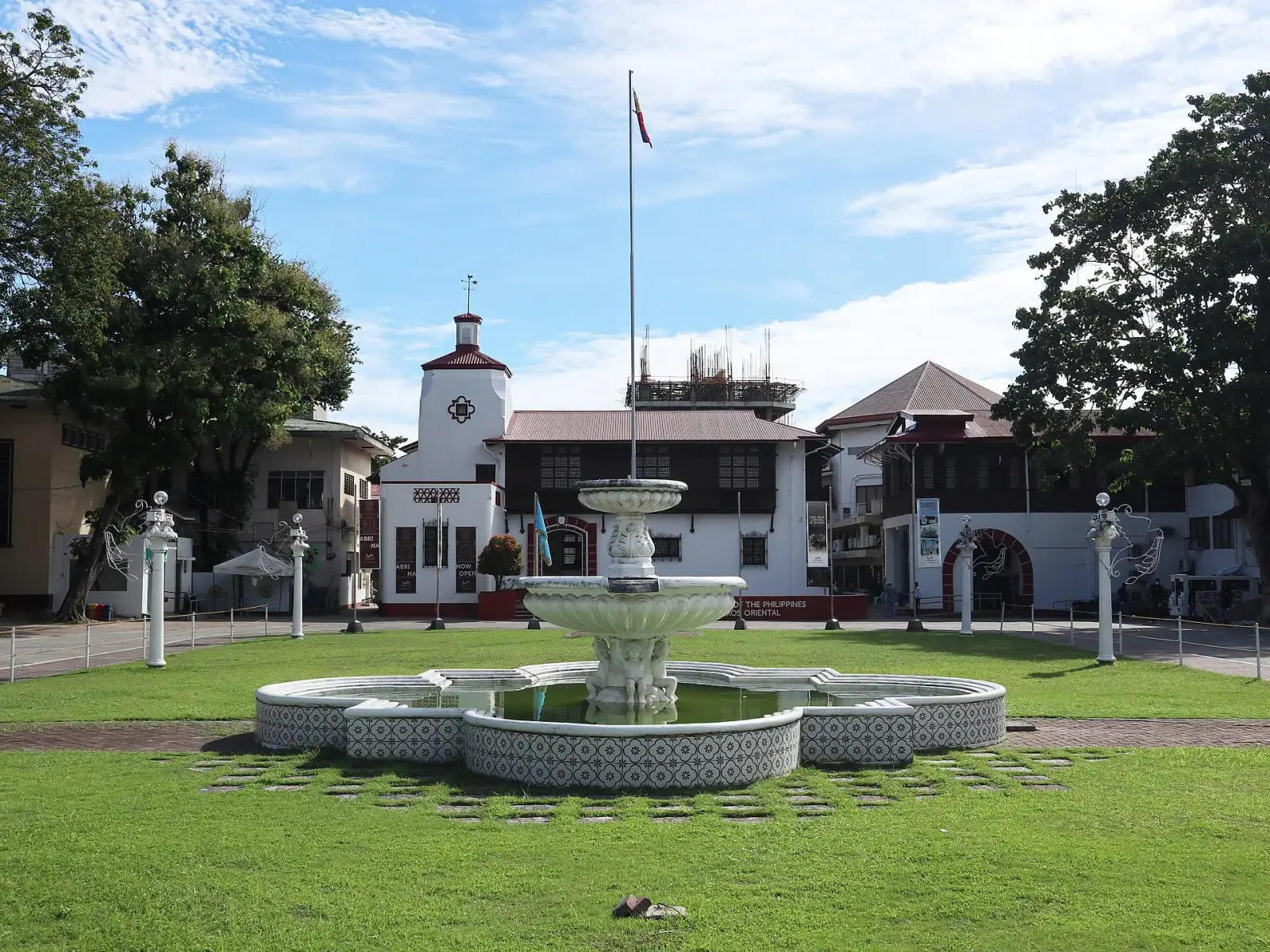 Dumaguete City Hall National Museum with fountain and green lawn, Negros Oriental, Philippines