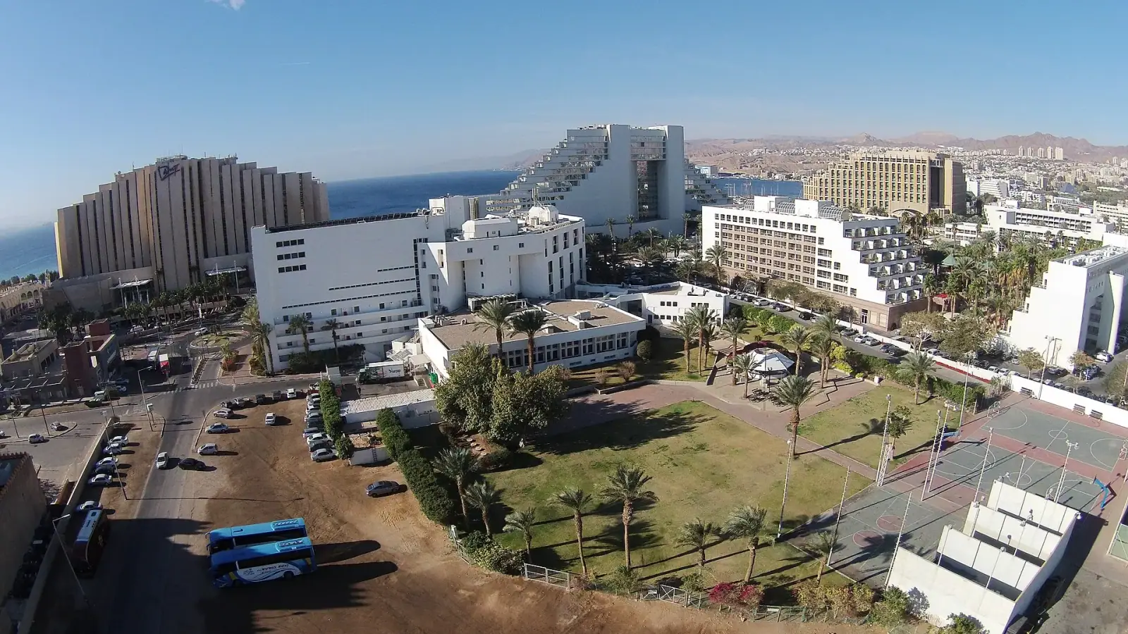 Aerial view of Eilat hotel strip and Red Sea coastline with Edom Mountains in the background