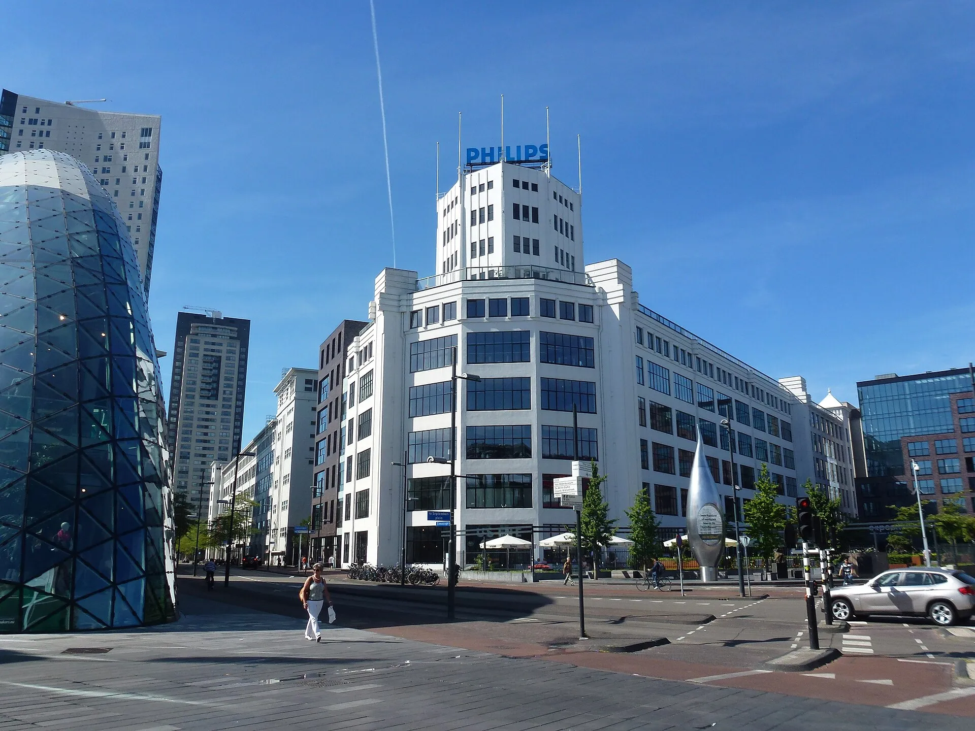 Eindhoven city centre with Lichttoren Philips building and De Blob glass structure under blue sky
