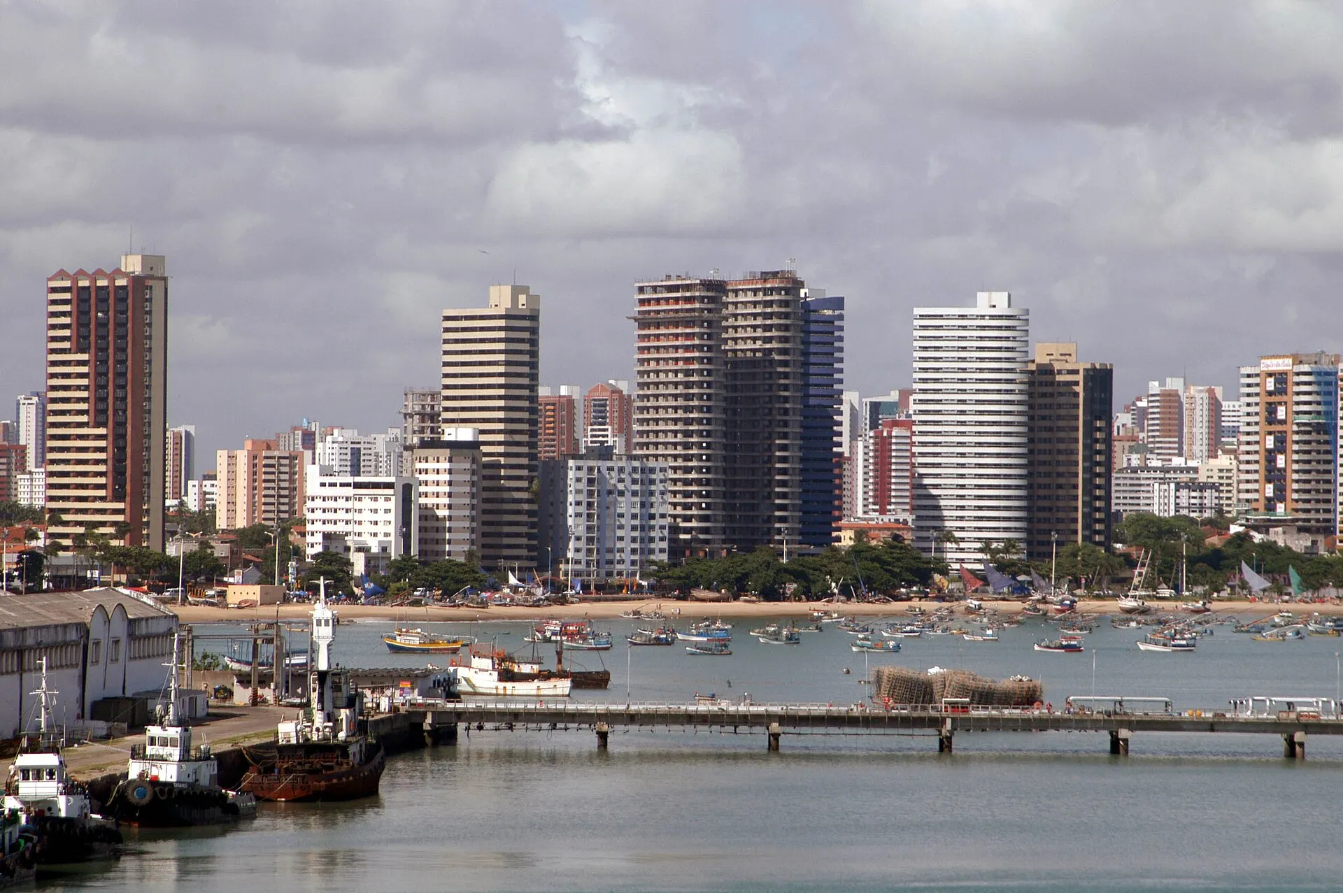 Fortaleza waterfront with the beach, moored fishing boats and the downtown skyline