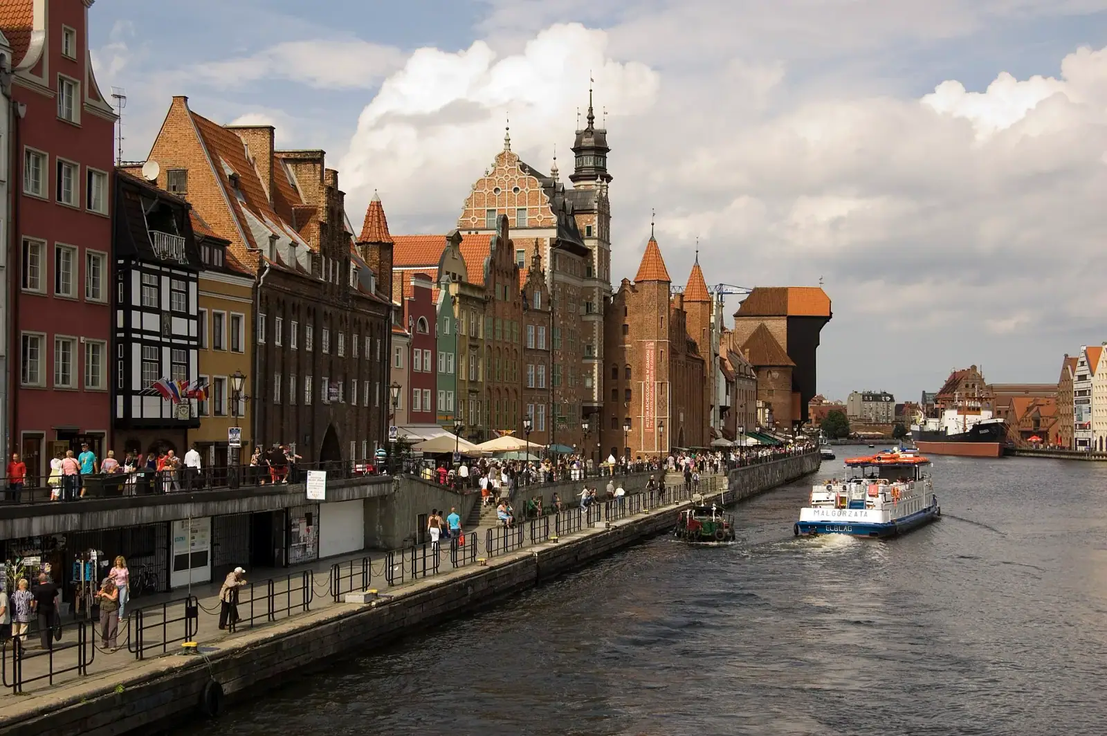 Gdańsk waterfront with colorful Hanseatic facades and the medieval Crane on the Motława river