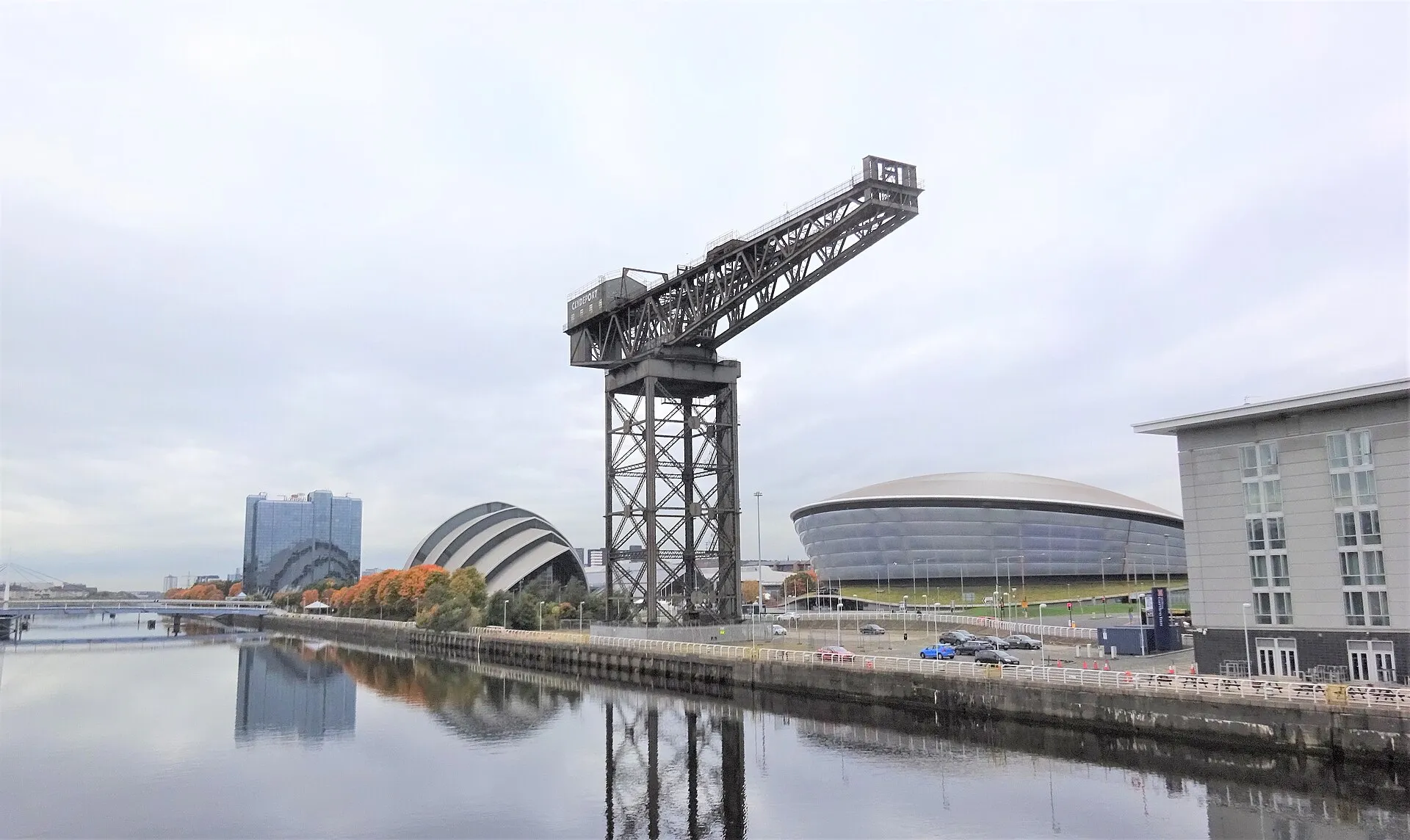 The Finnieston Crane and River Clyde waterfront with the SEC Armadillo and OVO Hydro in Glasgow