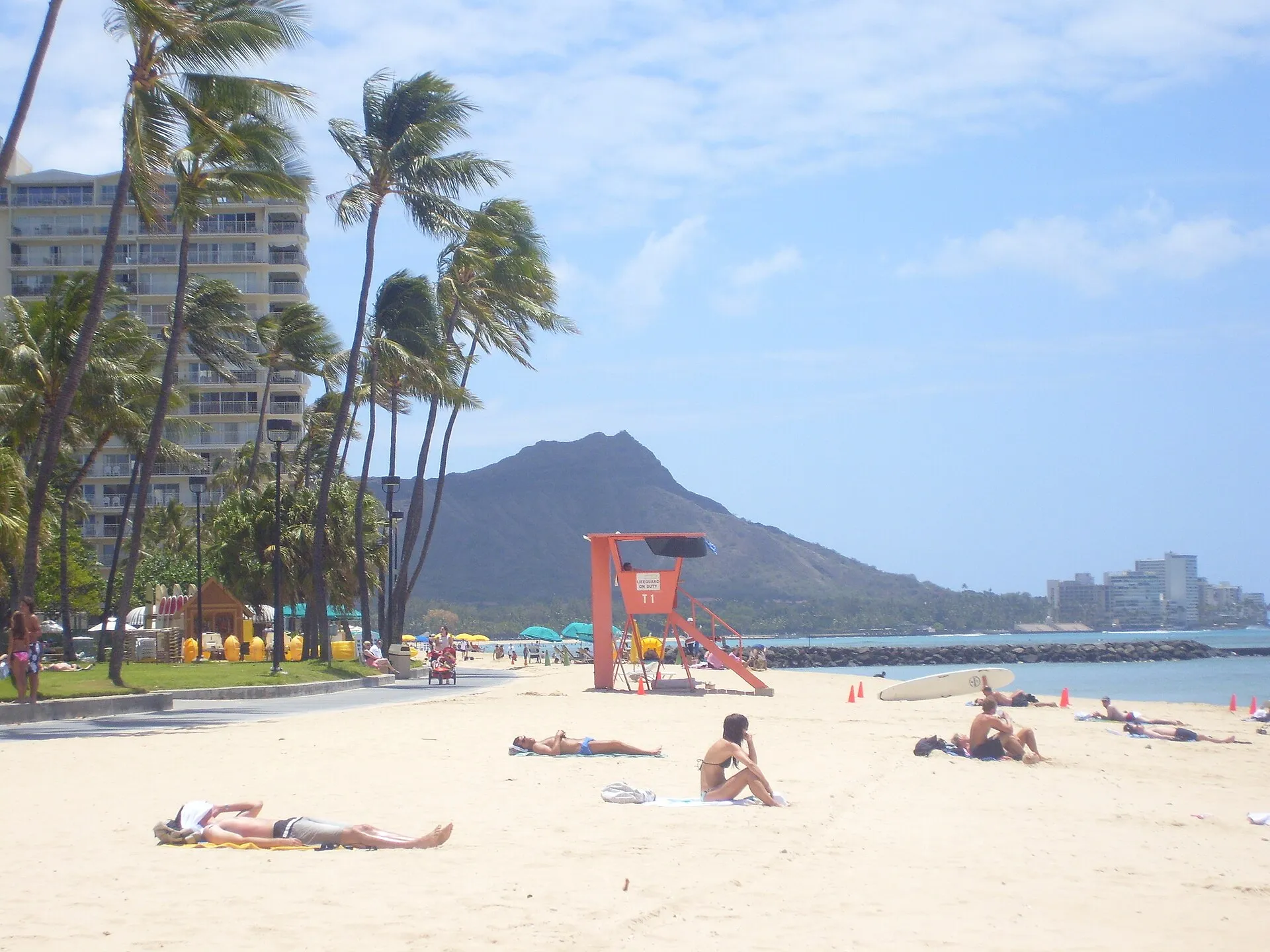 Waikiki Beach with palm trees and Diamond Head crater in Honolulu, Hawaii