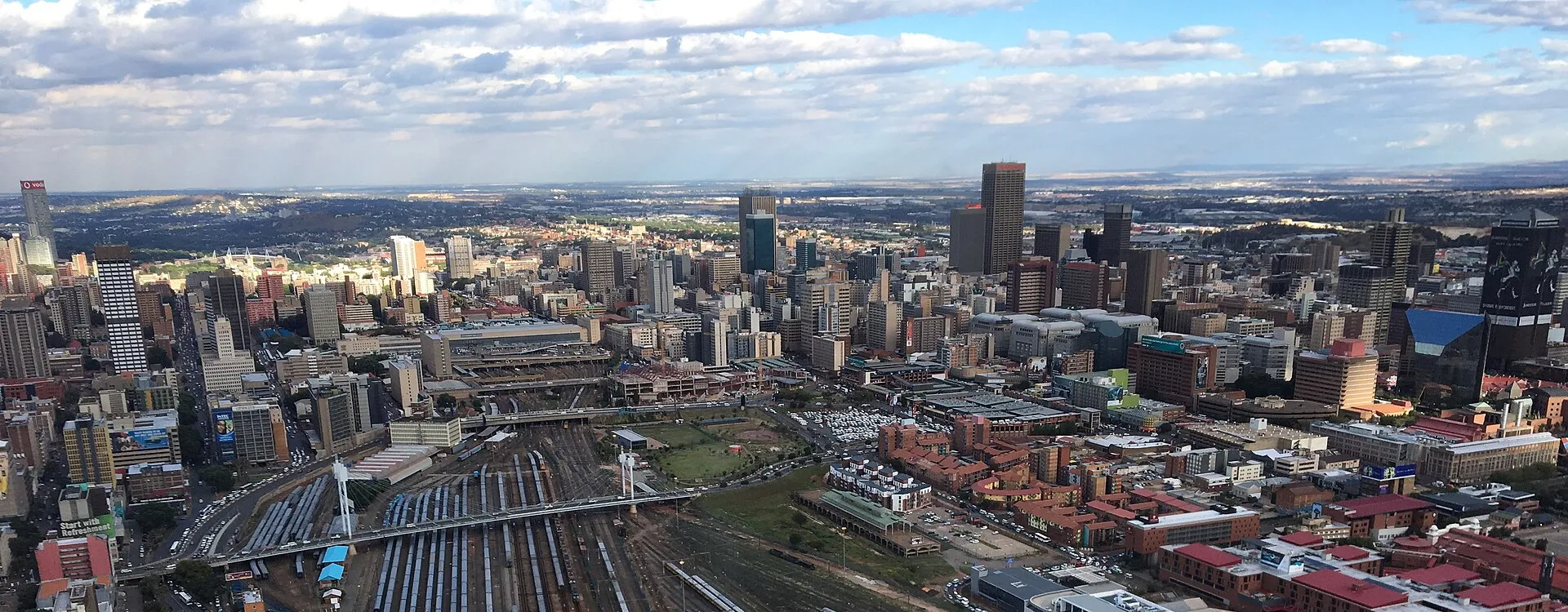 Panoramic aerial view of Johannesburg CBD skyline with Nelson Mandela Bridge