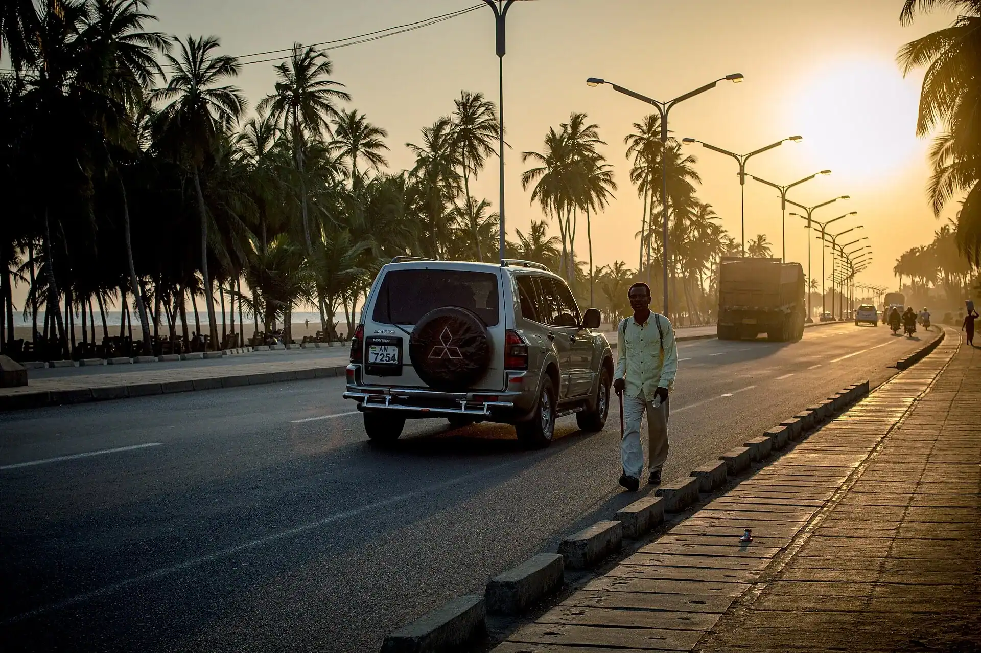 The palm-lined coast road through Lome