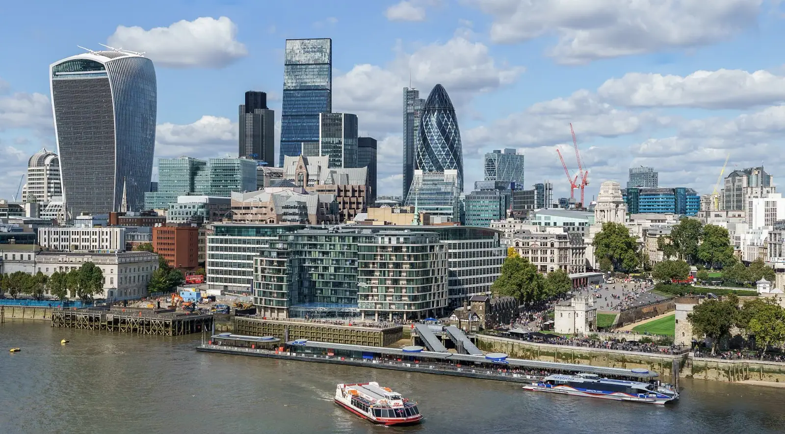 City of London skyline with the Walkie Talkie, Gherkin, and River Thames on a bright day