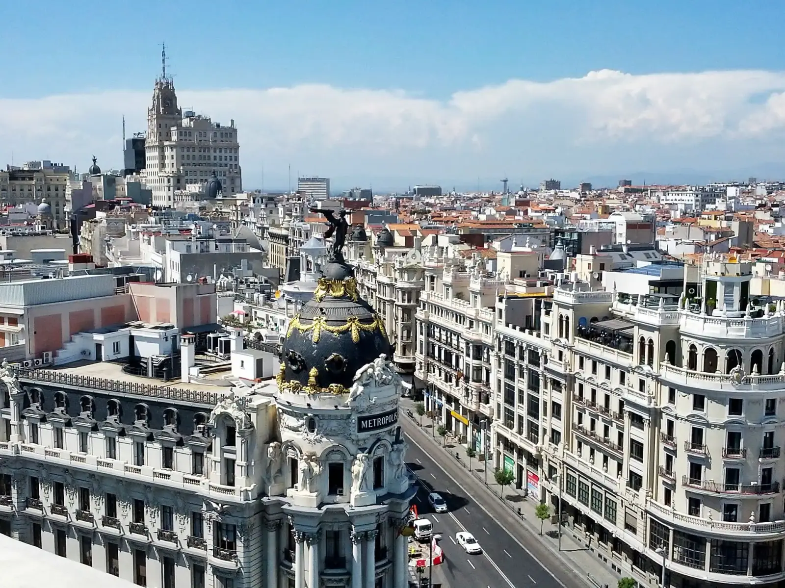 Aerial view of Madrid cityscape featuring the Metropolis Building and Gran Via boulevard