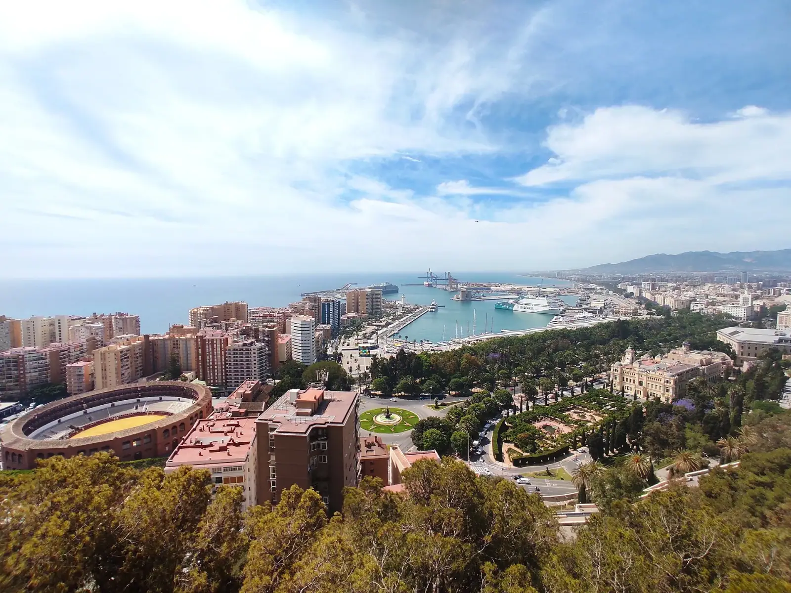 Aerial view of Málaga from Castillo de Gibralfaro showing the bullring, port, and city