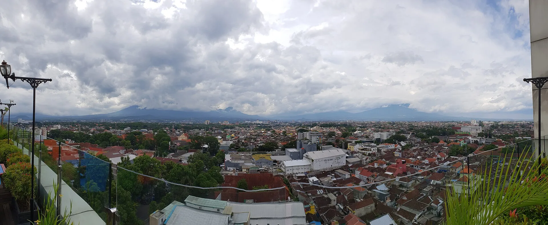 Panoramic view of Malang city with volcanic mountains in the background