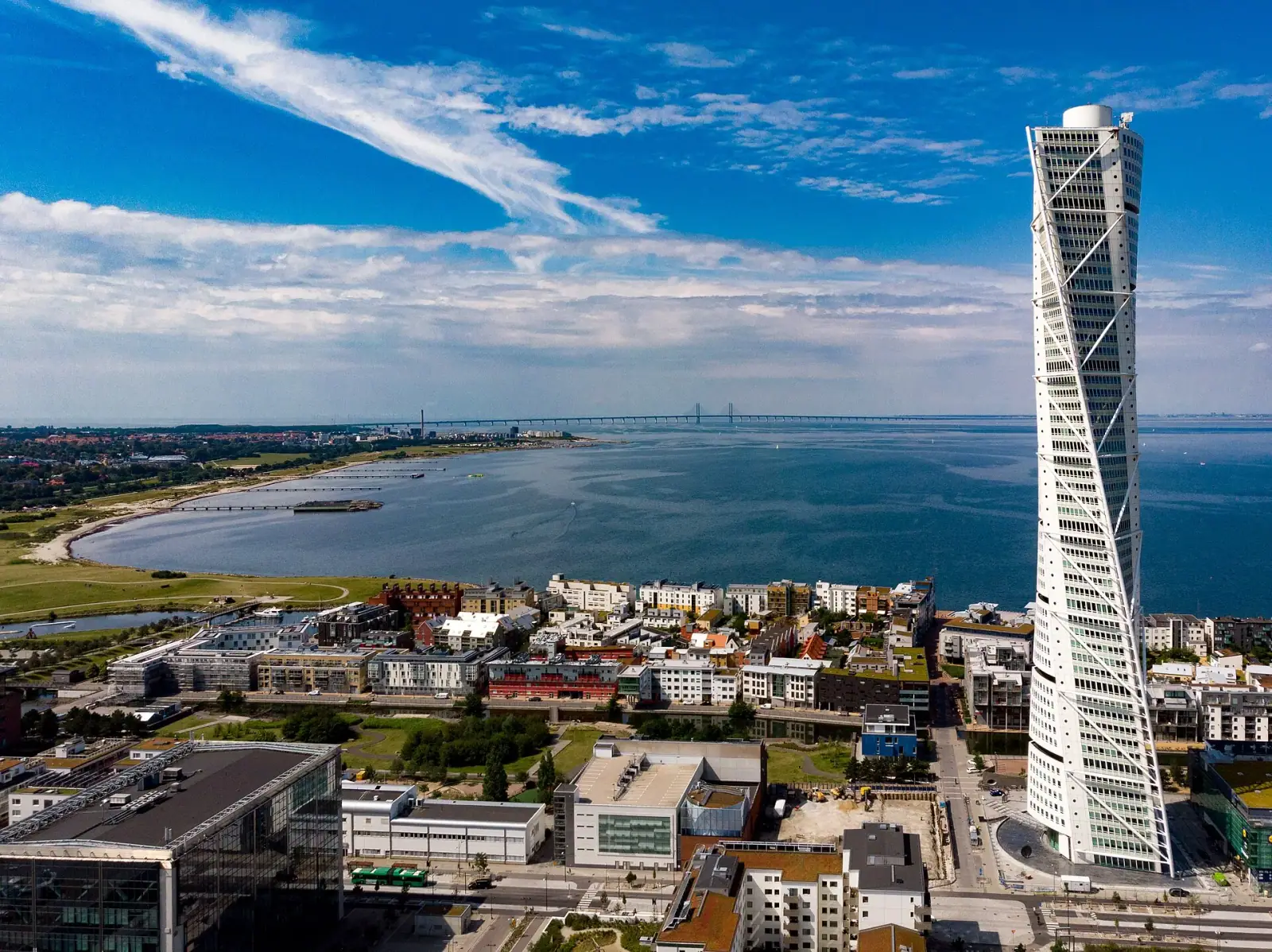 Aerial view of Malmö with the Turning Torso skyscraper and Öresund Bridge in the background