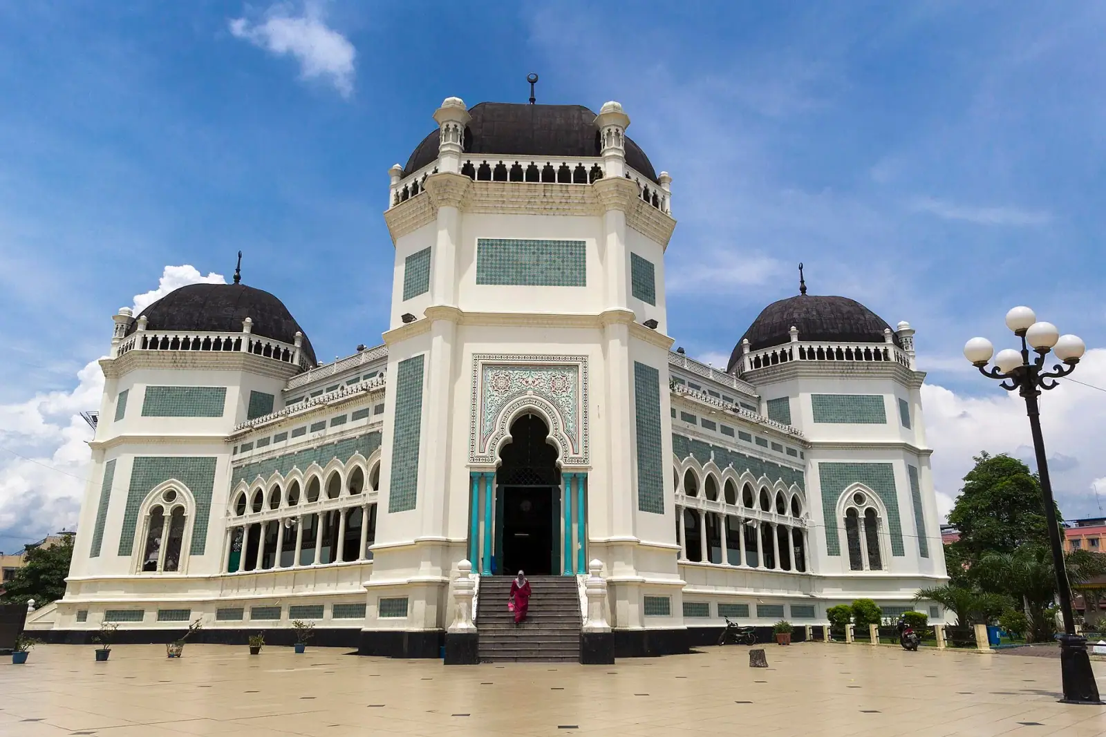 Masjid Raya Al-Mashun Grand Mosque in Medan, Indonesia, under blue sky