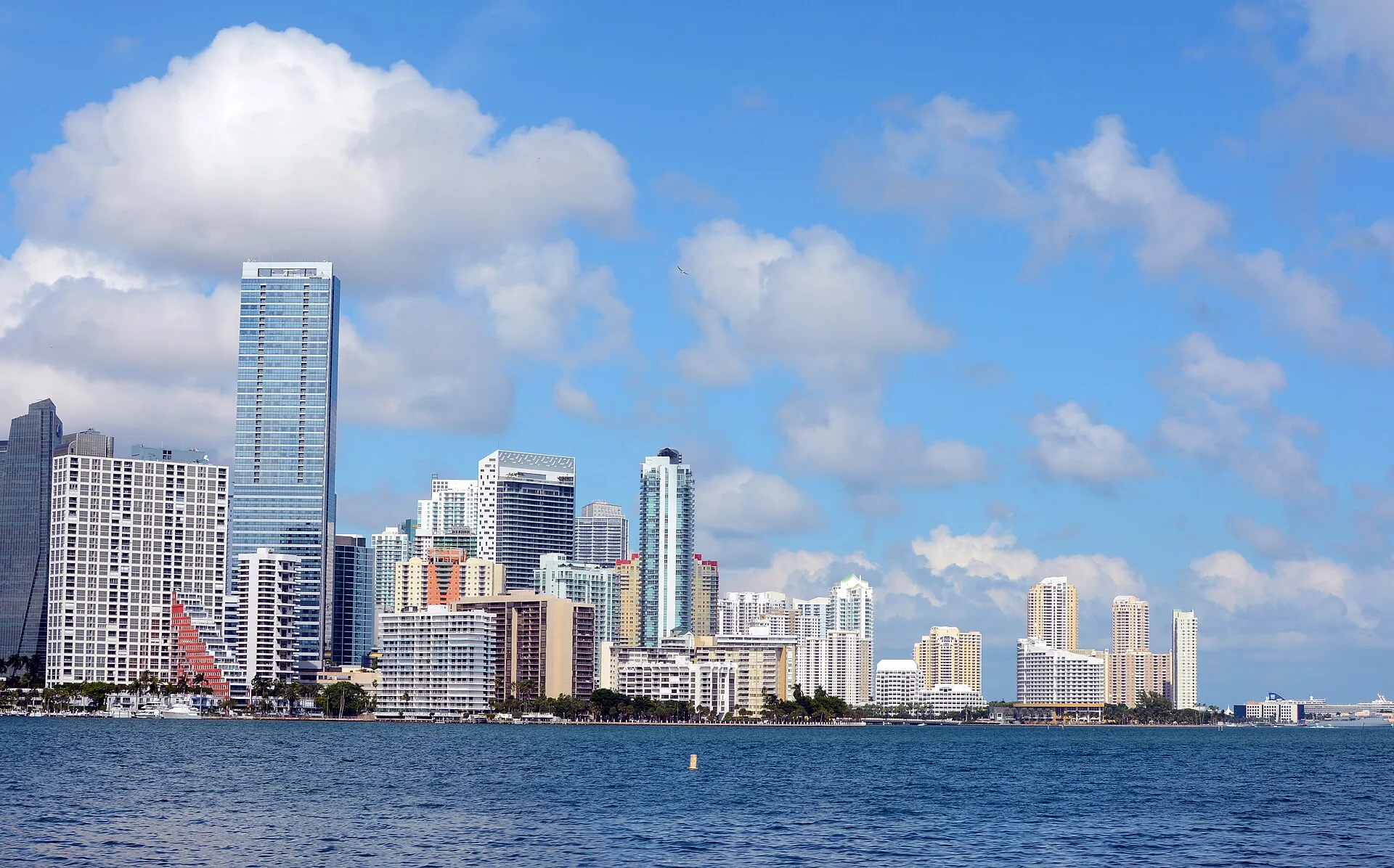 Downtown Miami skyline viewed from Biscayne Bay under blue sky