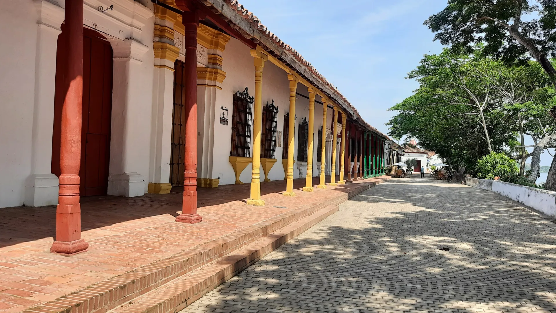 The colonial riverfront arcade with colored columns in Mompox, Colombia