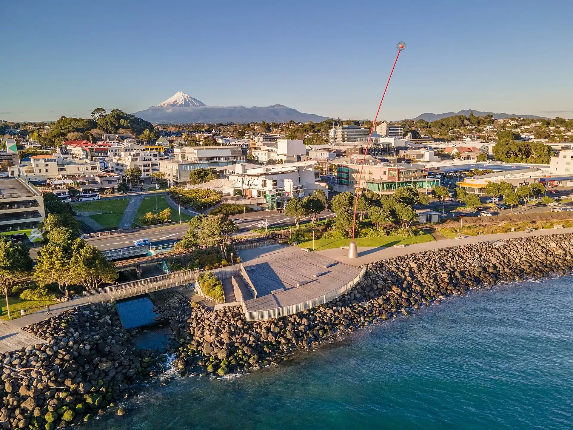 New Plymouth on its coast with Mount Taranaki behind