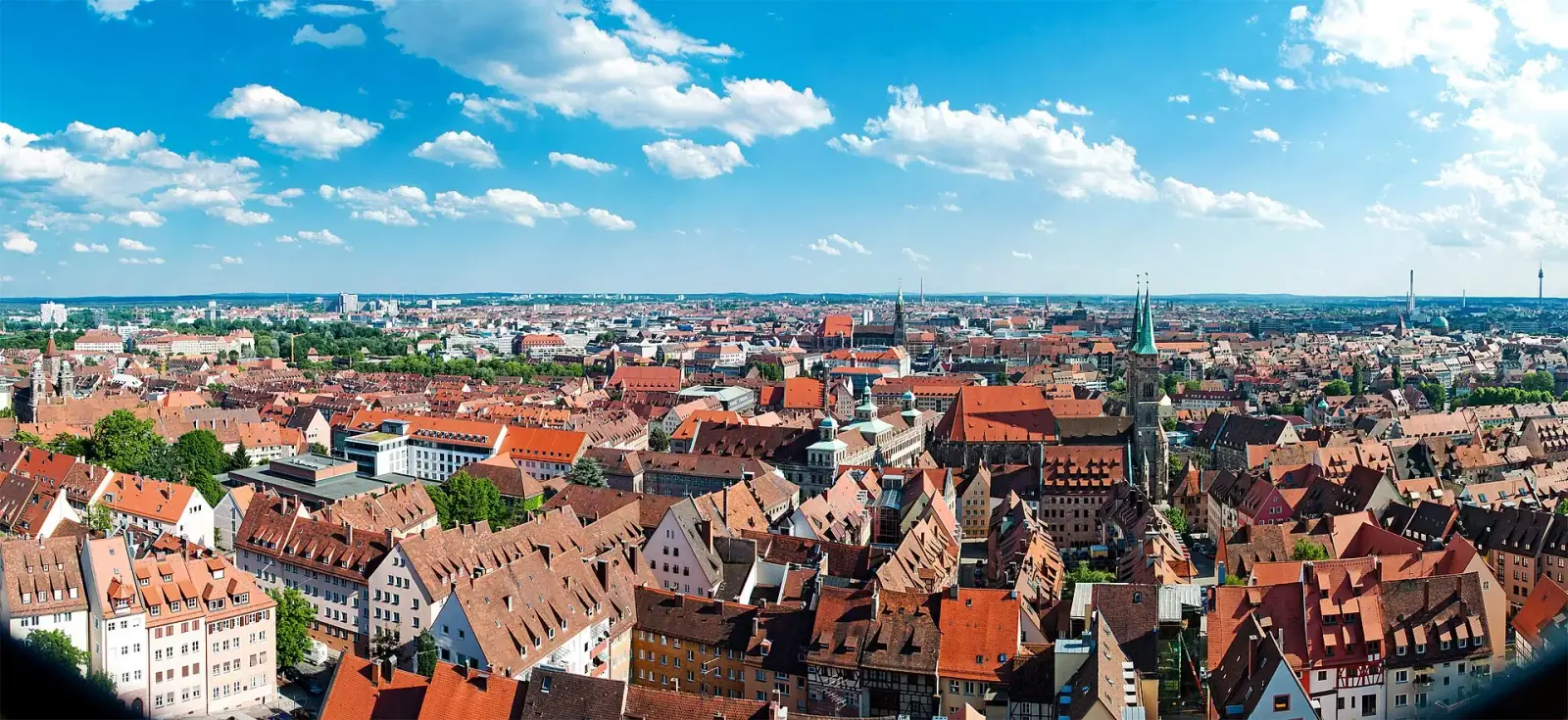 Panoramic view of Nuremberg old town with red-tiled rooftops and church spires