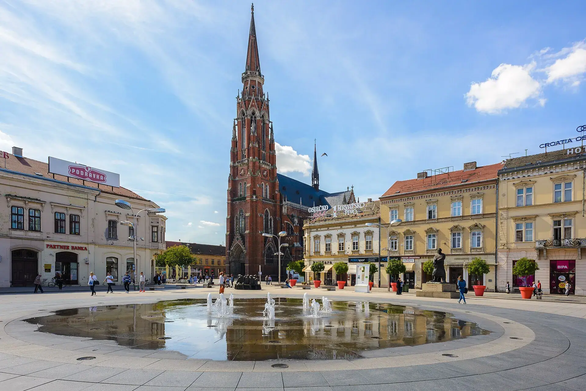 The main square in Osijek, with the neo-gothic church behind it