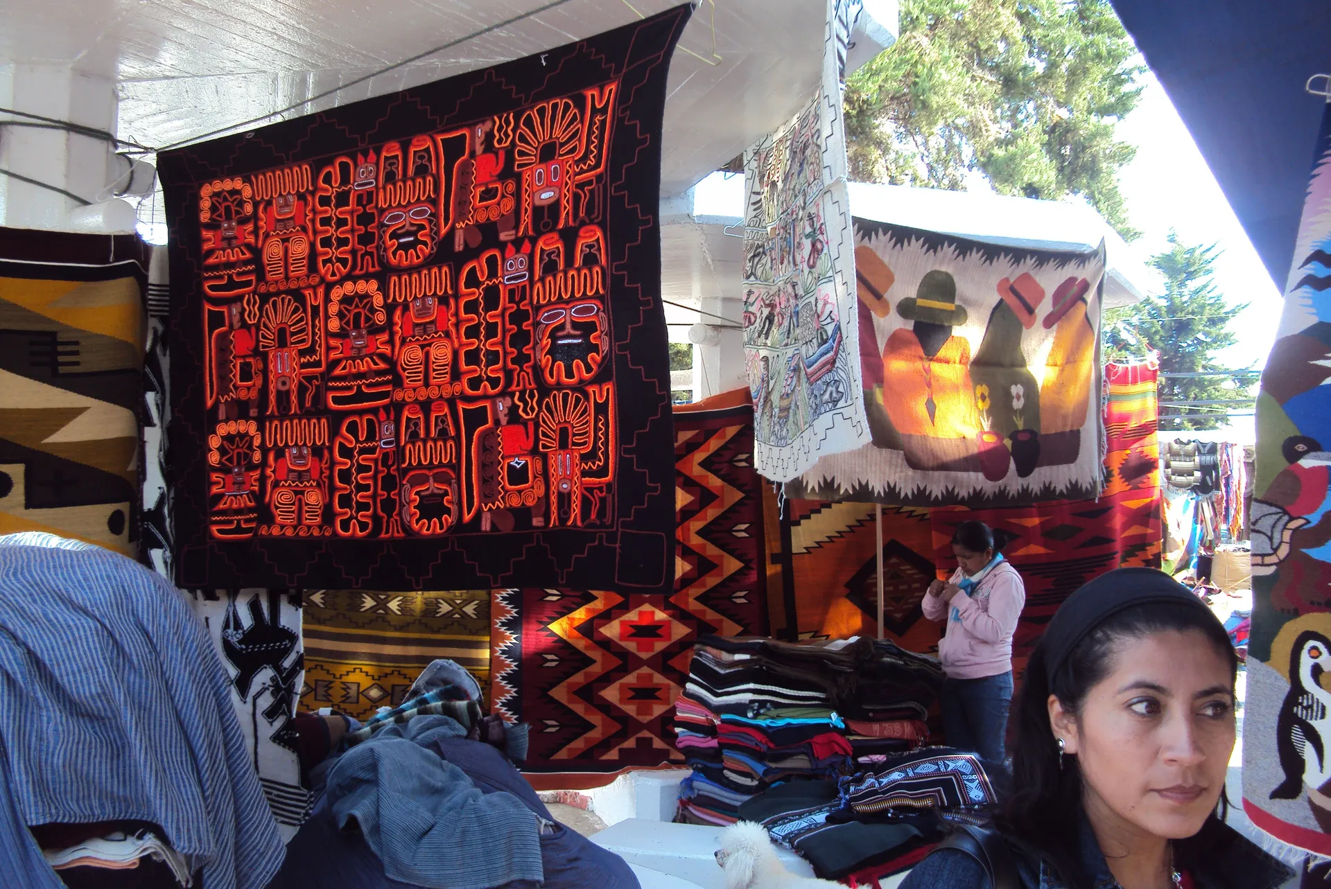 Colorful woven textiles at the Otavalo craft market, Ecuador