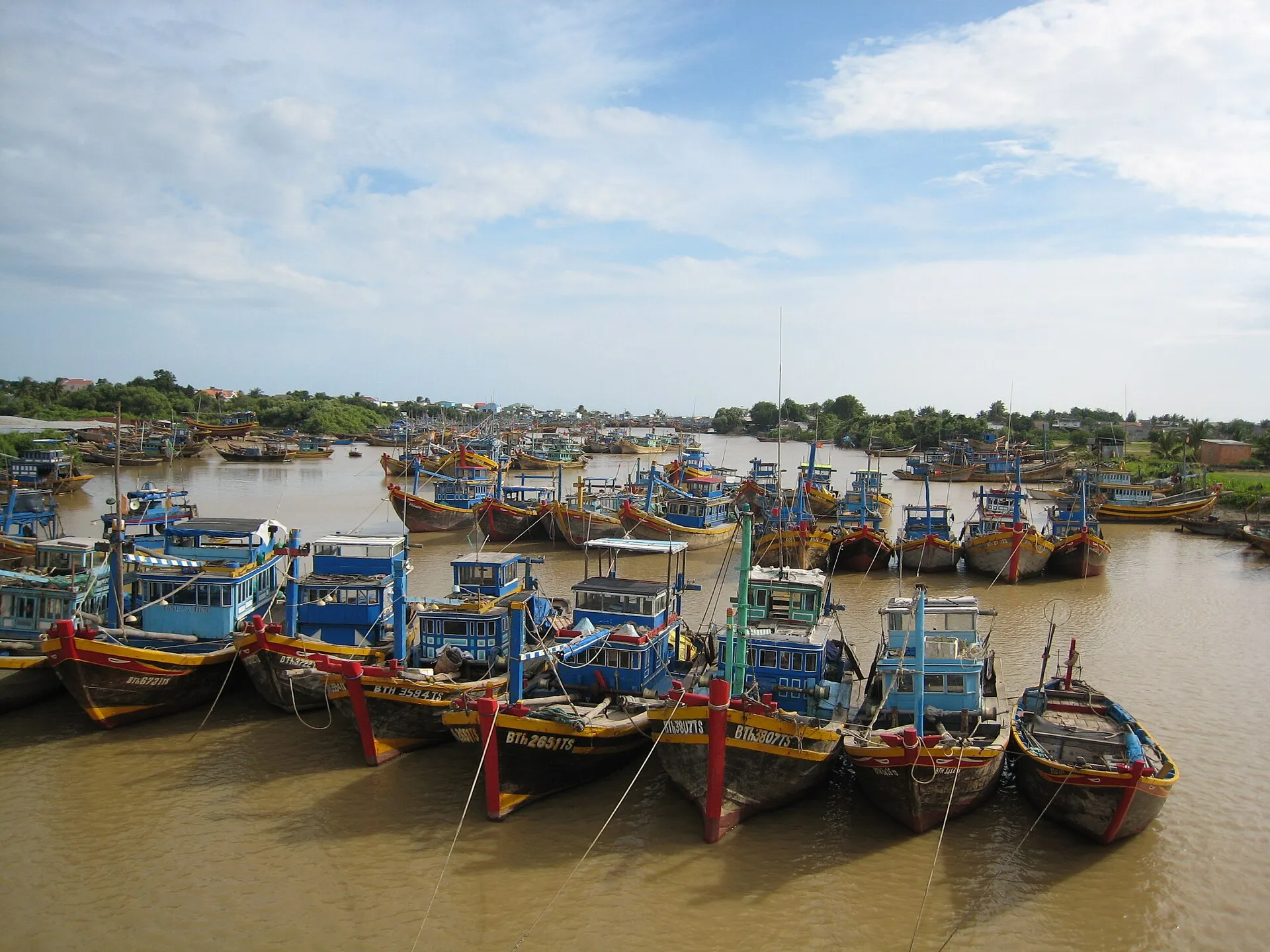 Fishing boats moored in the river mouth at Phan Thiet