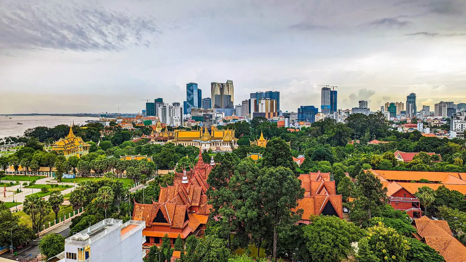 Aerial view of Phnom Penh skyline with the Royal Palace in the foreground and modern high-rises behind