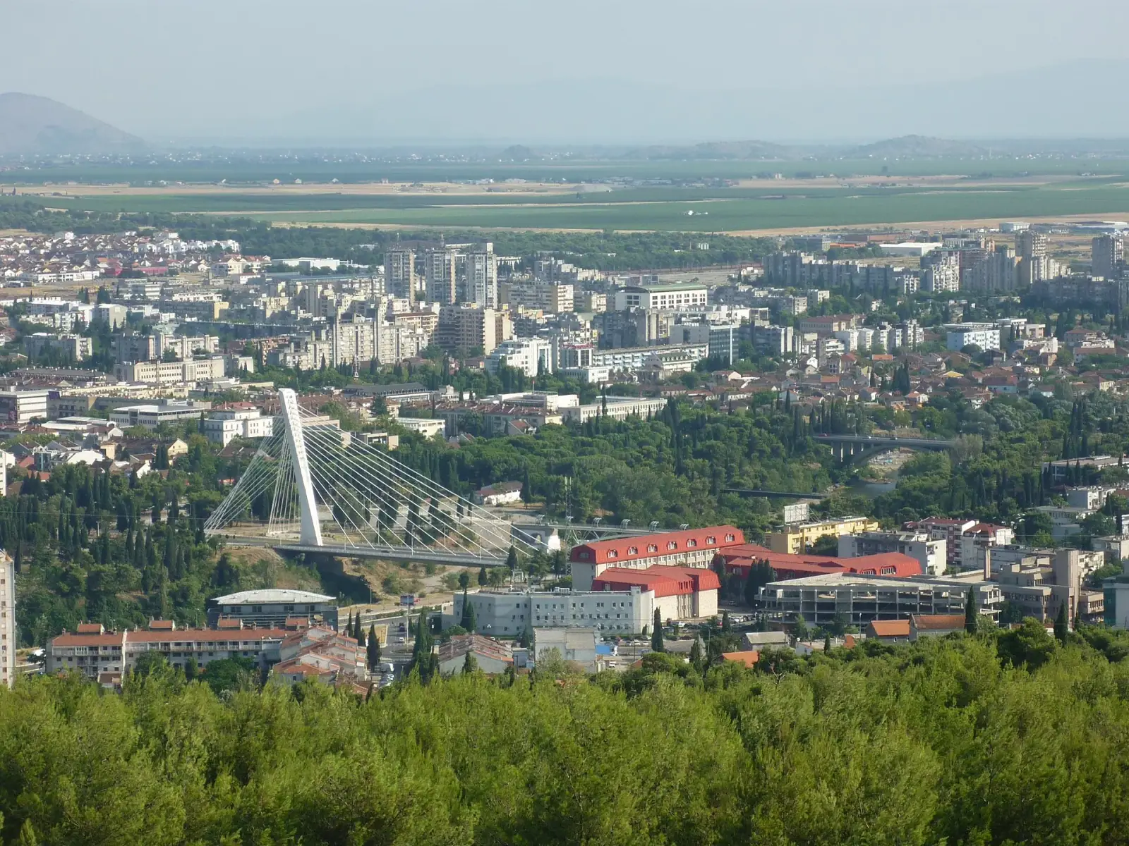 Aerial view of Podgorica with the Millennium Bridge and city skyline