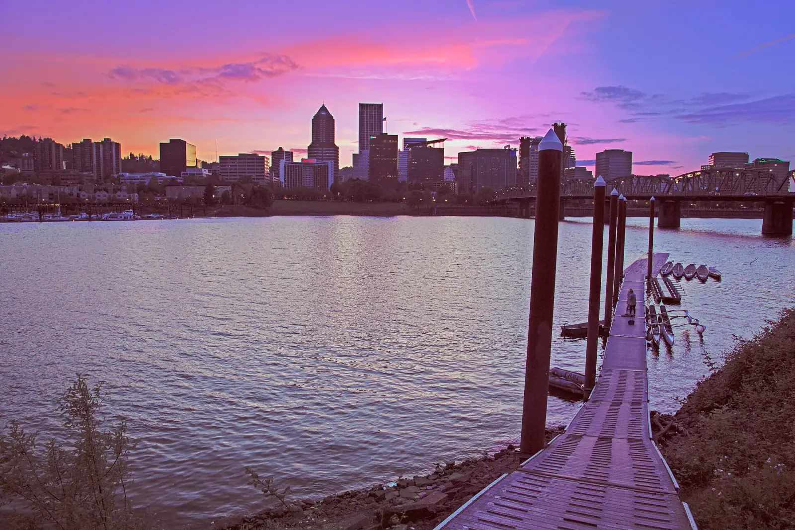 Portland skyline at sunset from the Eastbank Esplanade, with Hawthorne Bridge and Willamette River