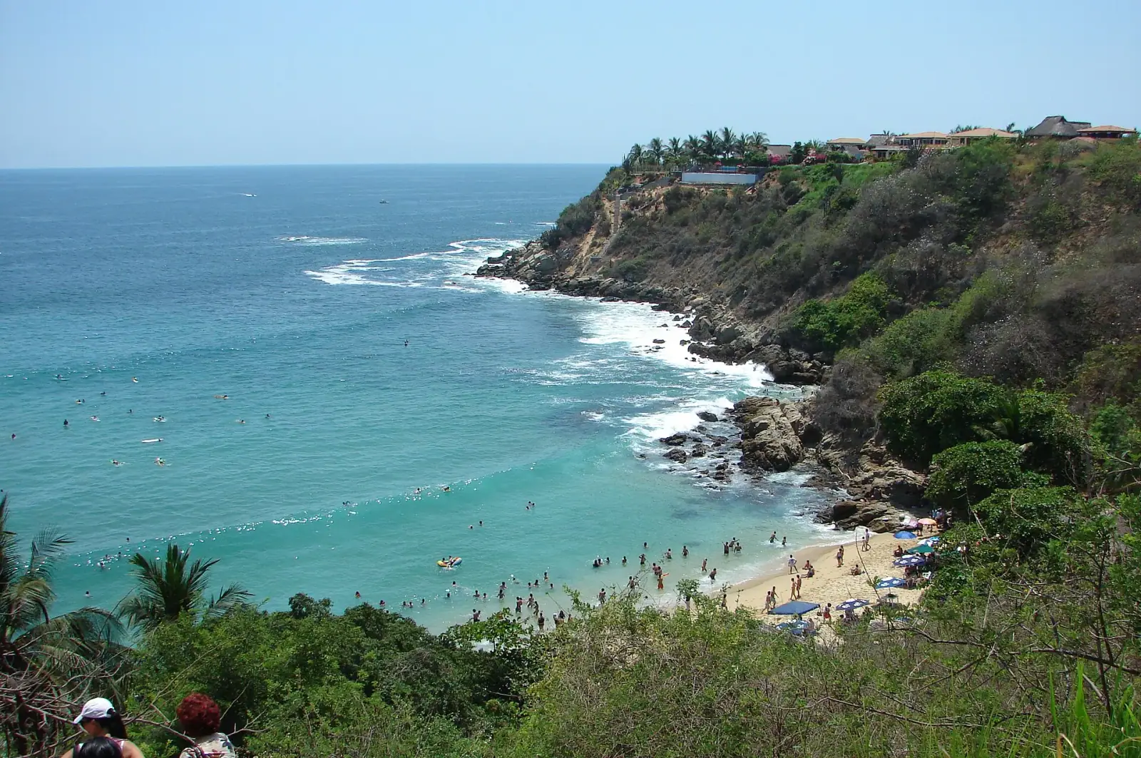 Playa Carrizalillo cove beach with turquoise water and cliffs, Puerto Escondido, Oaxaca