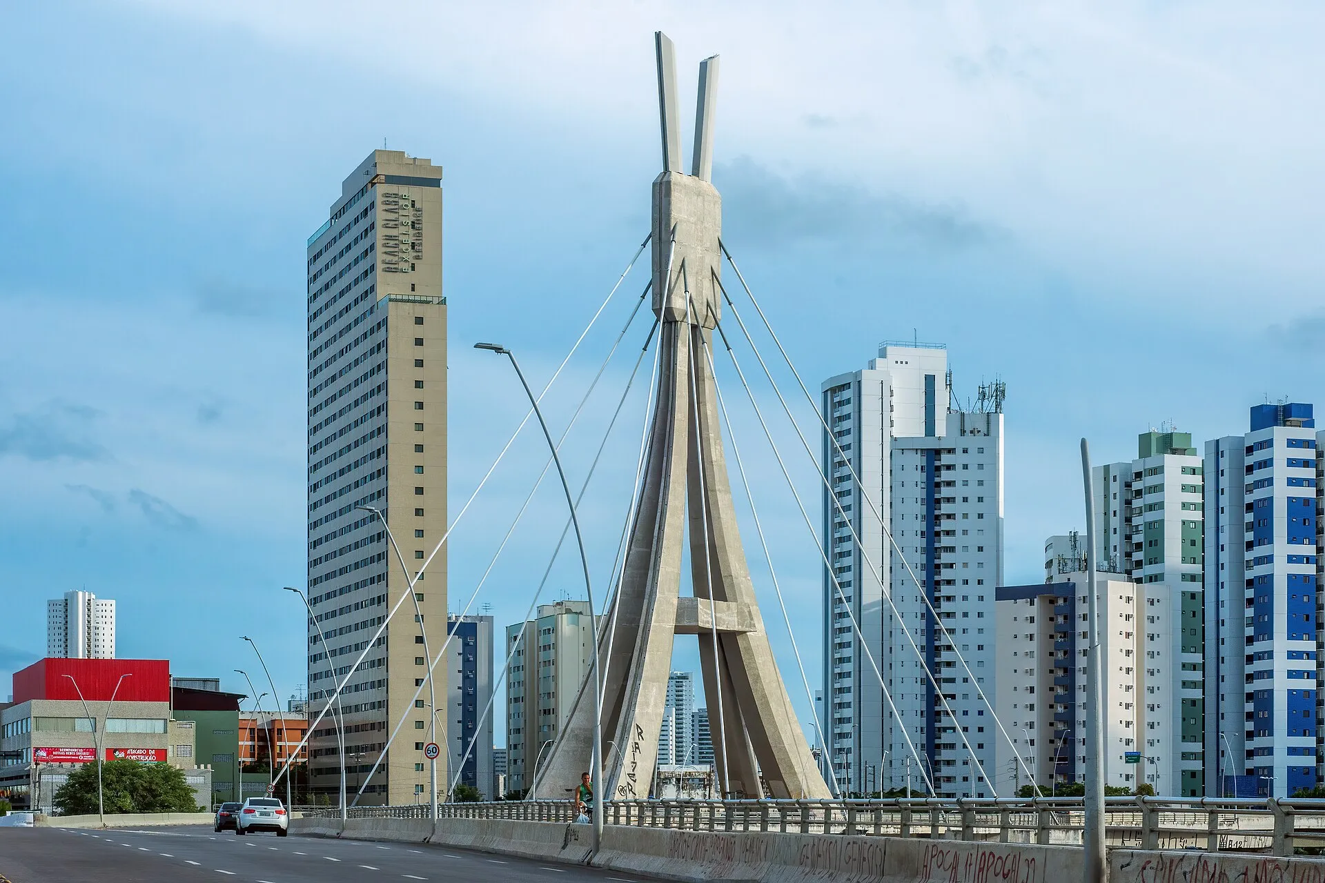Encanta Moca cable-stayed bridge with Recife city skyline in the background