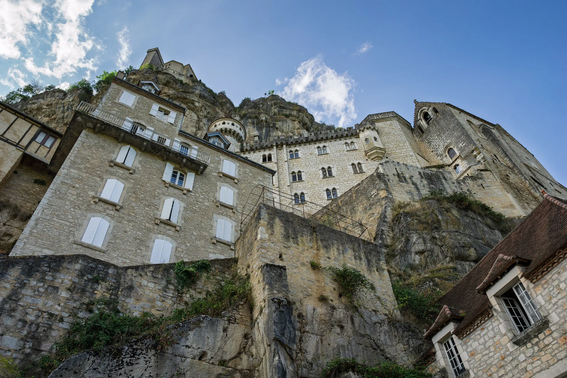 The sanctuary and houses of Rocamadour stacked up a limestone cliff, France