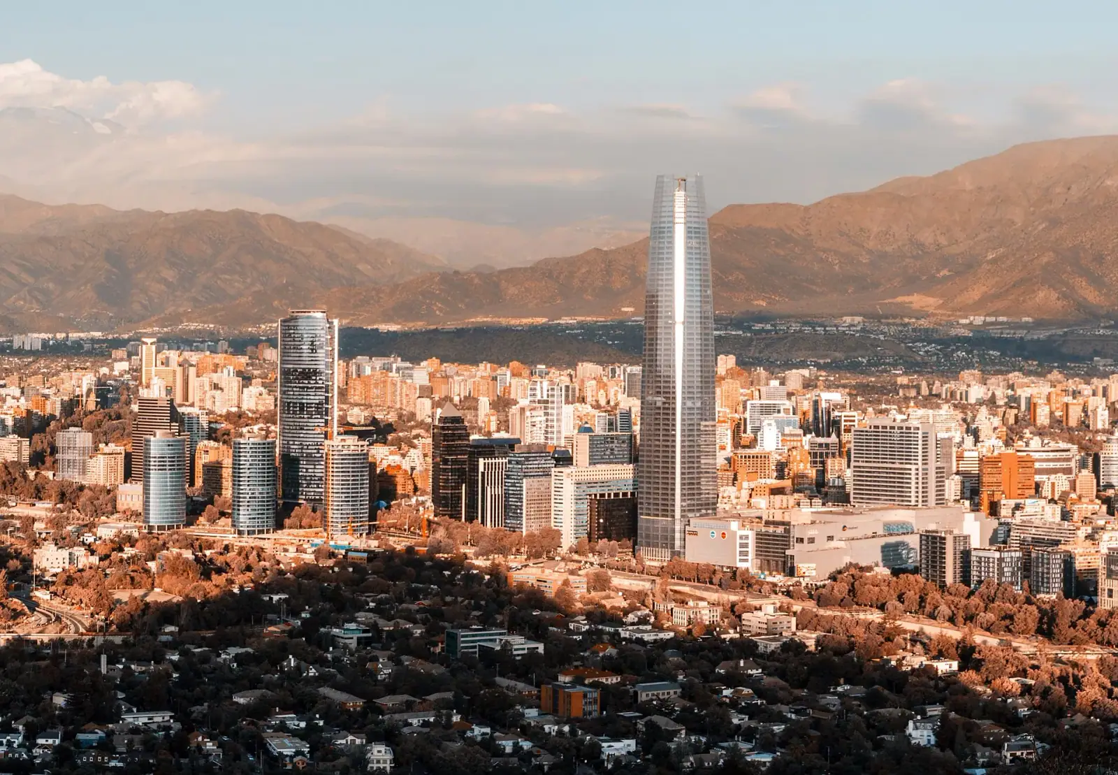 Santiago skyline with Gran Torre Santiago and the Andes mountains at golden hour