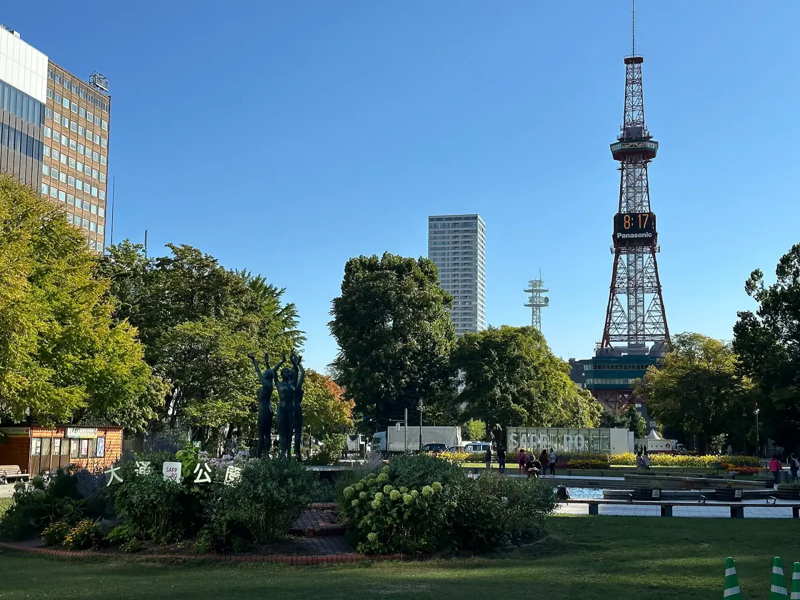 Sapporo TV Tower rising above Odori Park on a sunny day