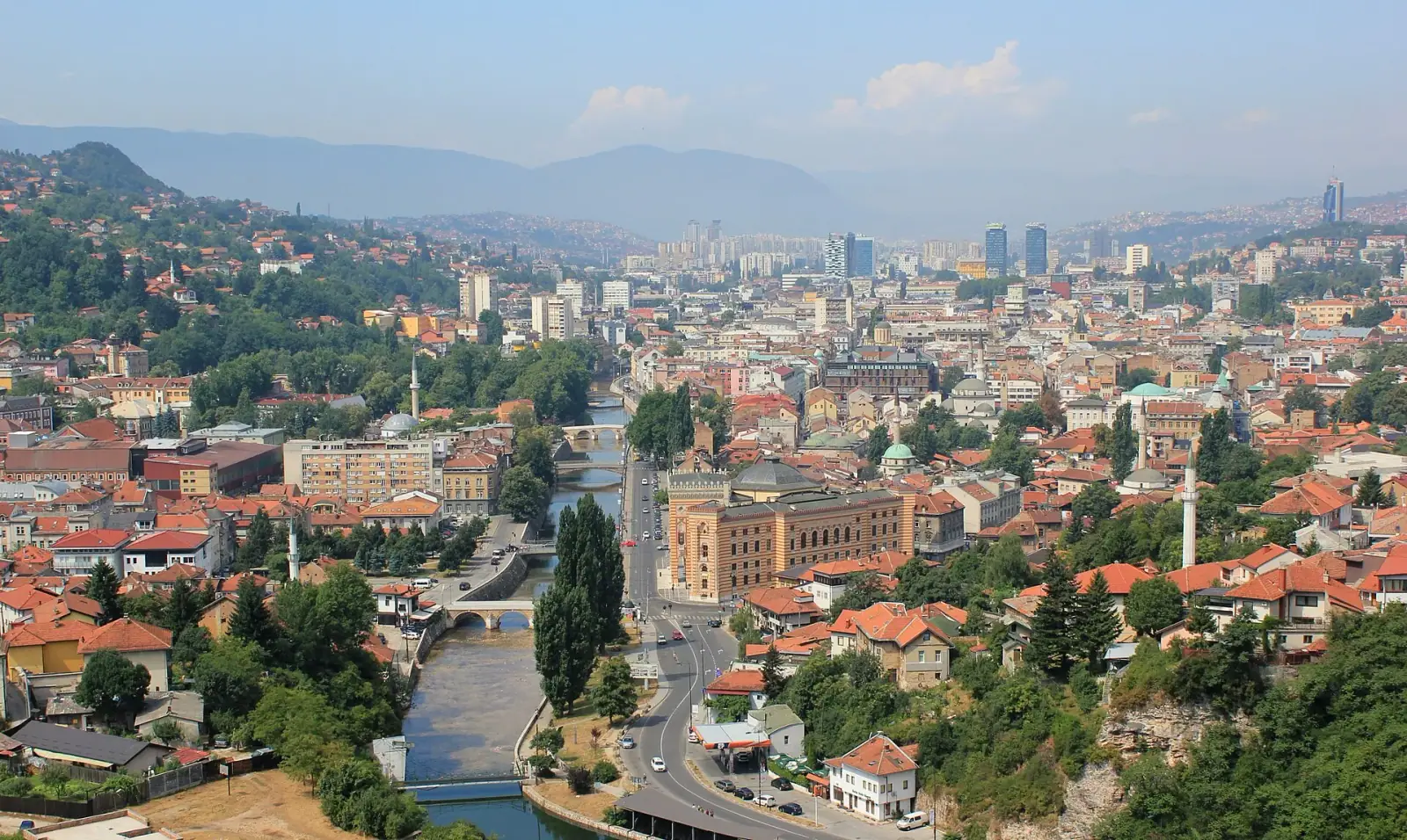 Panoramic view of Sarajevo old town, Miljacka River, and surrounding hills