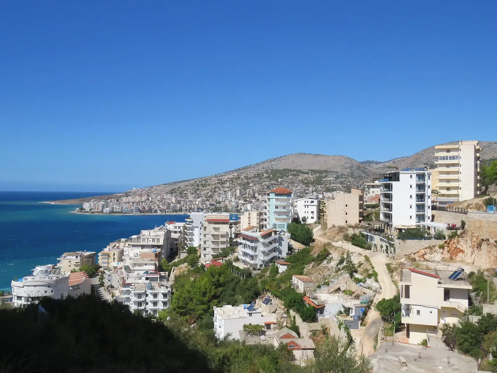 Sarandë cityscape and Ionian Sea bay seen from the south on a clear sunny day