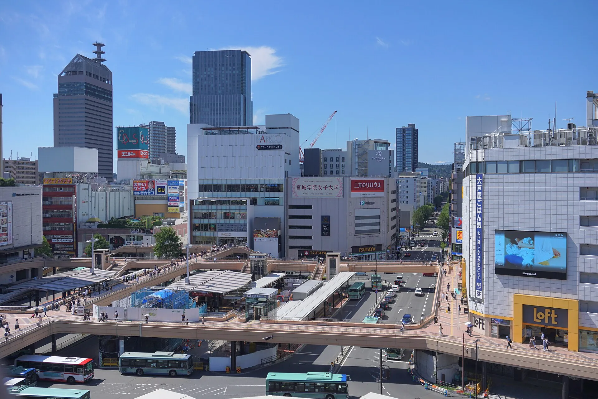 Downtown Sendai cityscape seen from the rooftop of Sendai Station on a sunny day