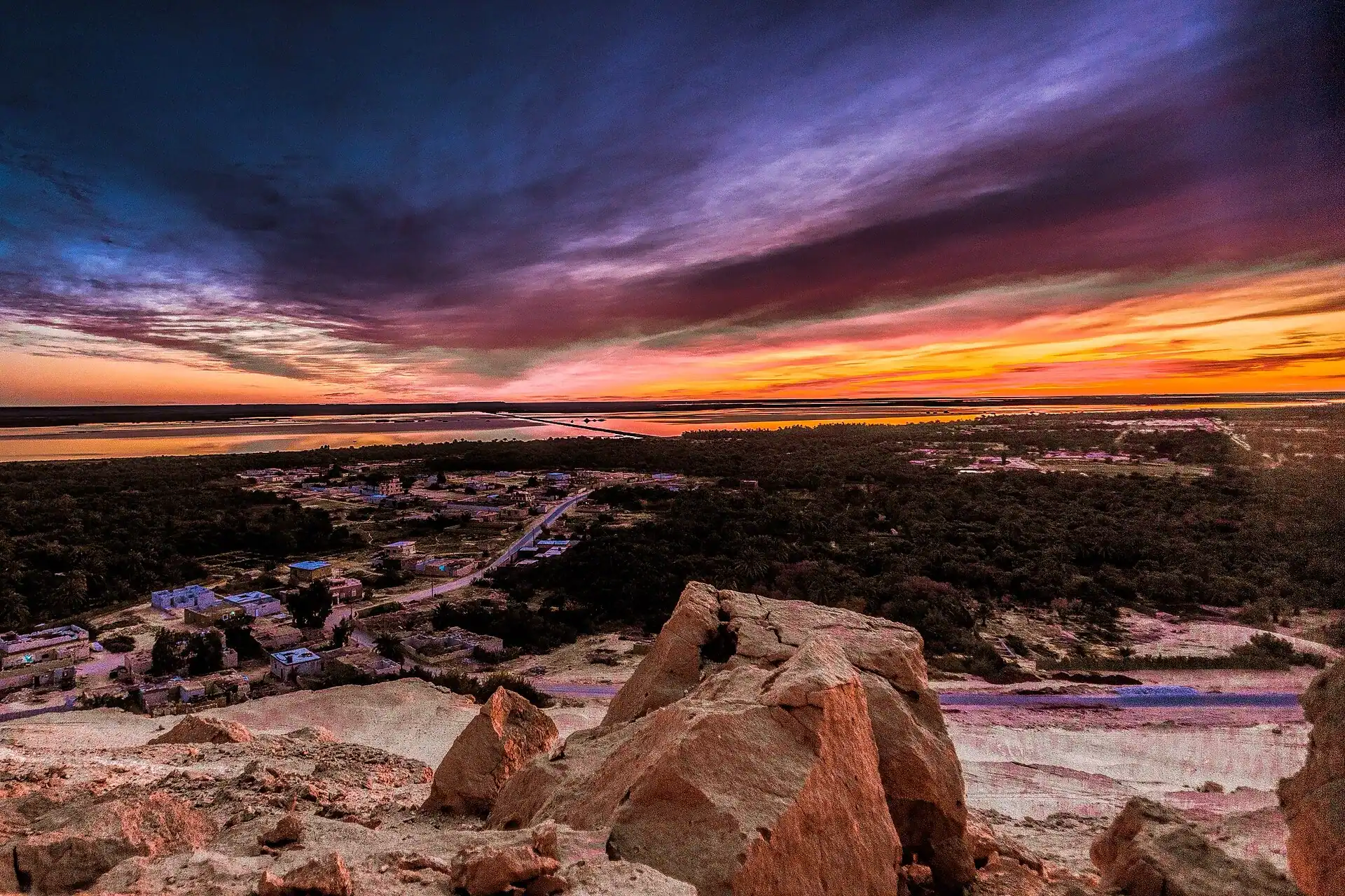 Sunset over the salt flats and rock of the Siwa oasis