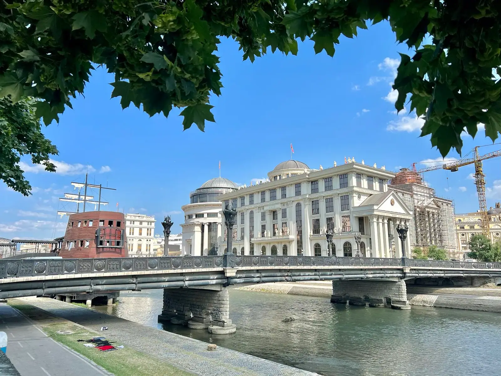 Art Bridge over the Vardar River with the neoclassical Archaeology Museum domes in the background, Skopje